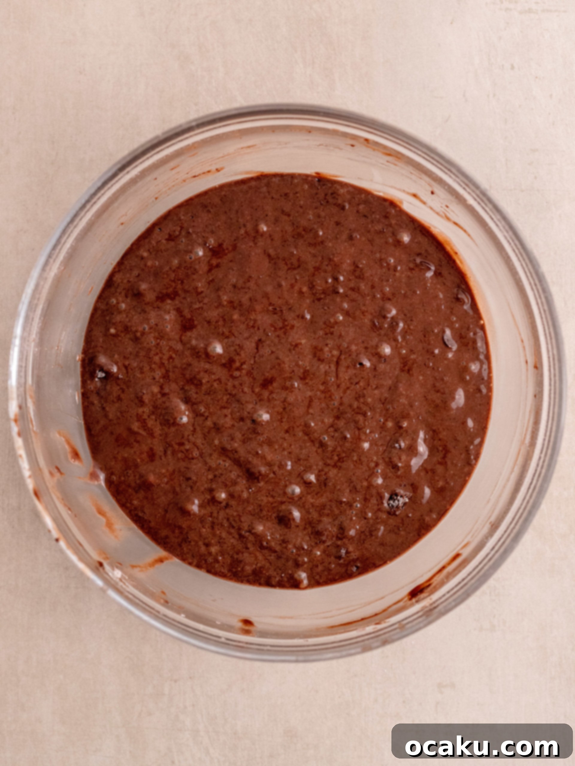 Muffins baking in the oven, starting to rise.