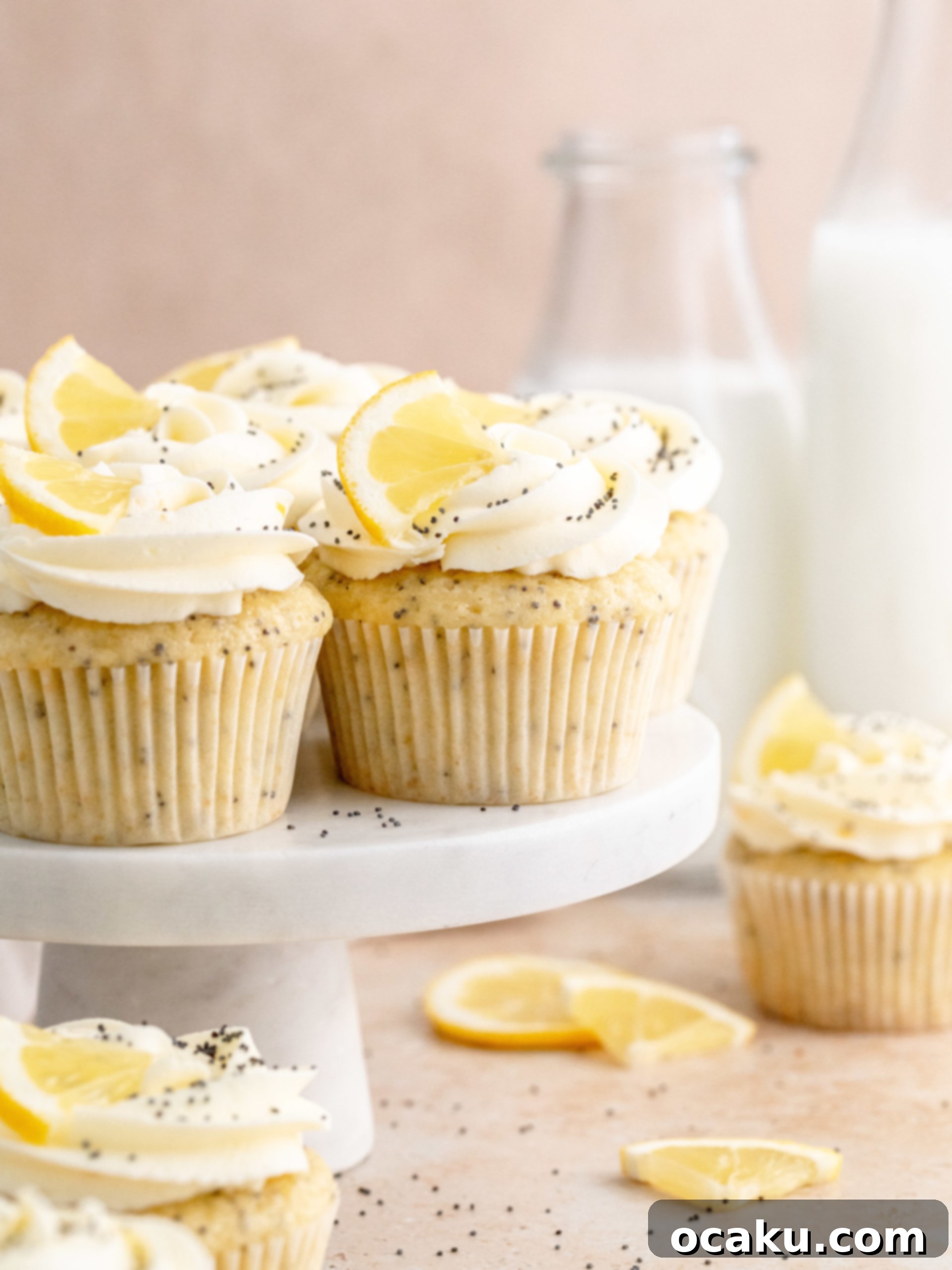 Zesty Lemon Poppy Seed Delights 11 Display of frosted Lemon Poppy Seed Cupcakes with lemon slices