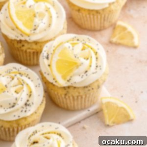 Zesty Lemon Poppy Seed Delights 13 Lemon Poppy Seed Cupcakes with a bright lemon slice