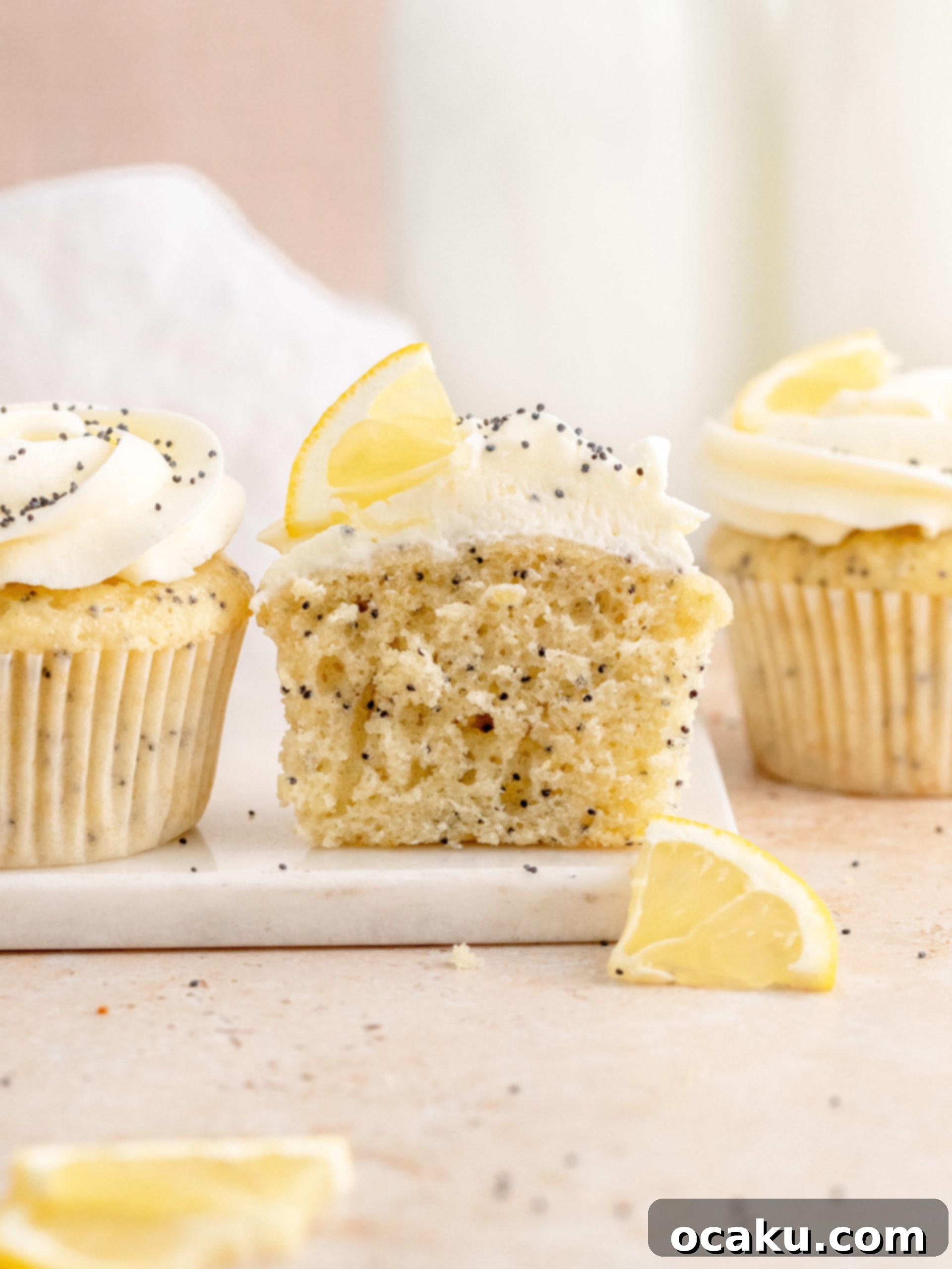 Aperol Spritz Cheesecake Close-up of fluffy Lemon Poppy Seed Cupcakes before frosting