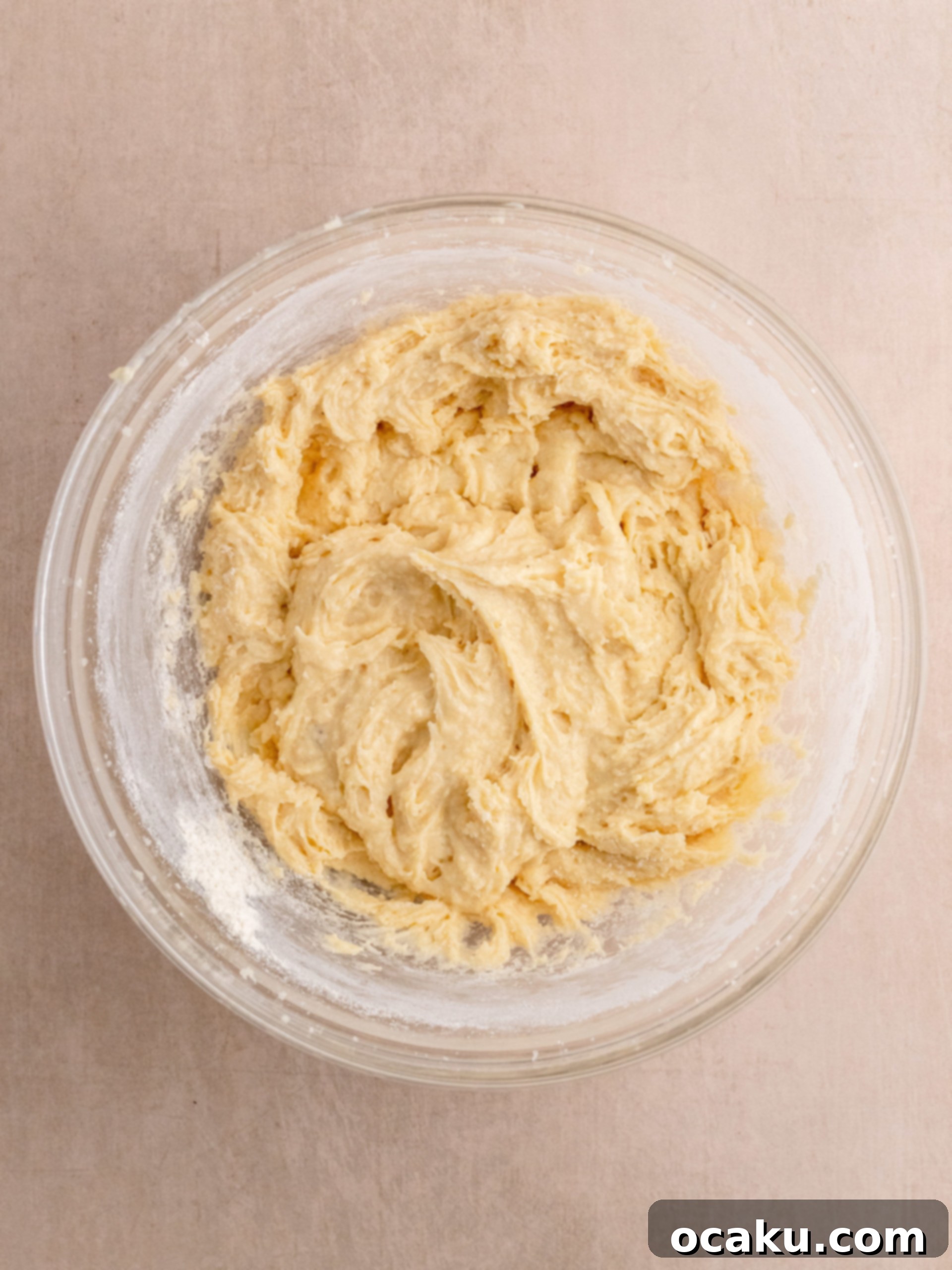 Delicious Almond Raspberry Cake 5 Mixing cake batter for a smooth consistency