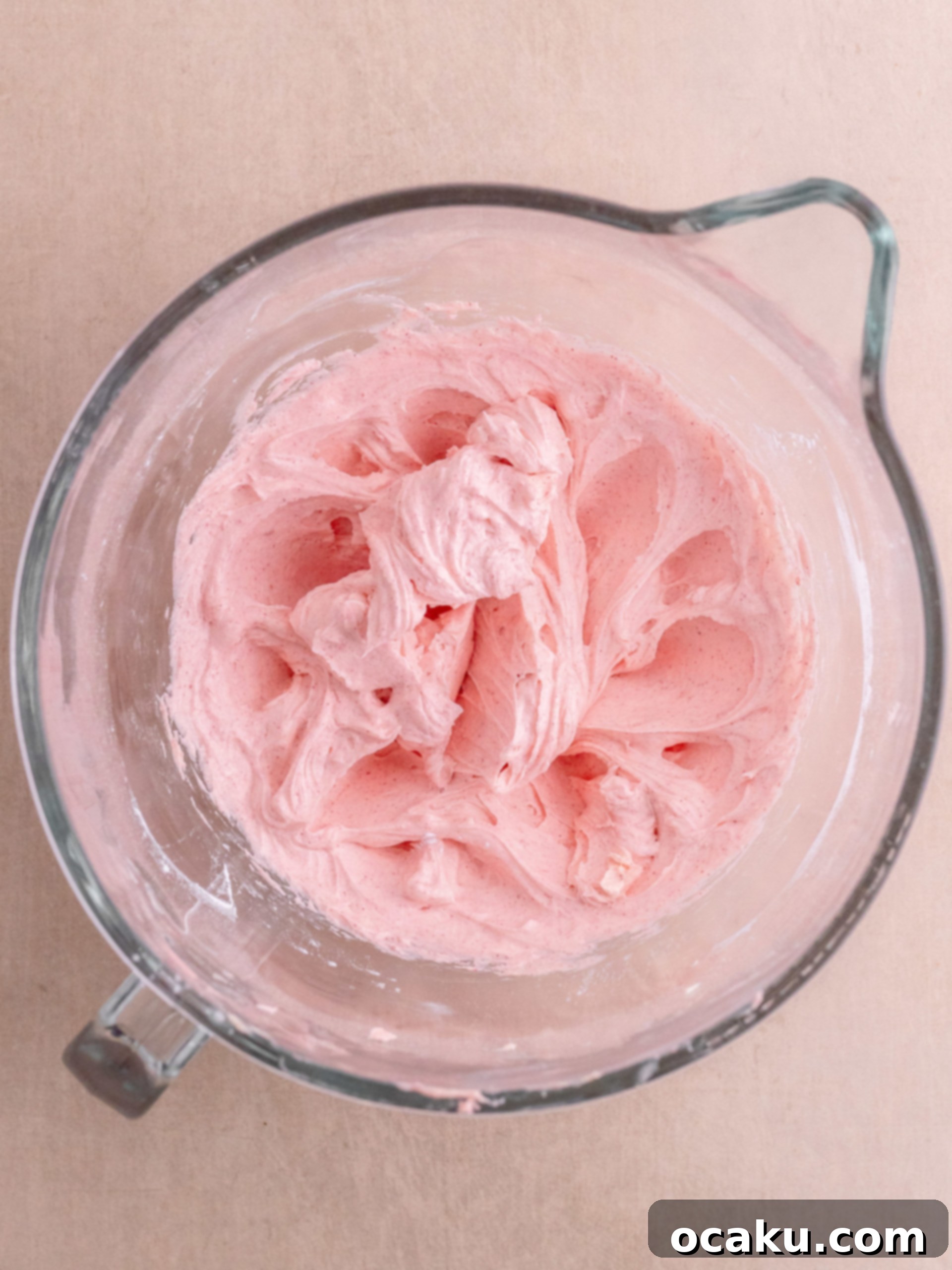 Delicious Almond Raspberry Cake 8 Adding raspberry powder and powdered sugar to butter