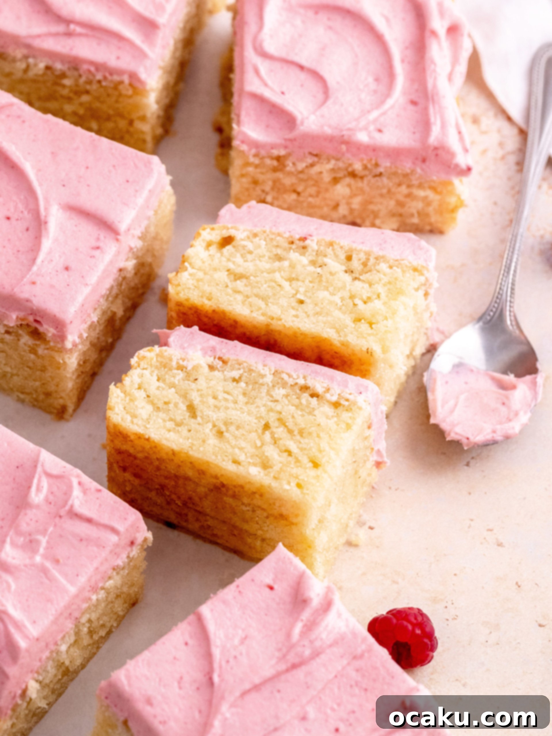 Delicious Almond Raspberry Cake 9 A slice of Almond Raspberry Cake with creamy raspberry frosting