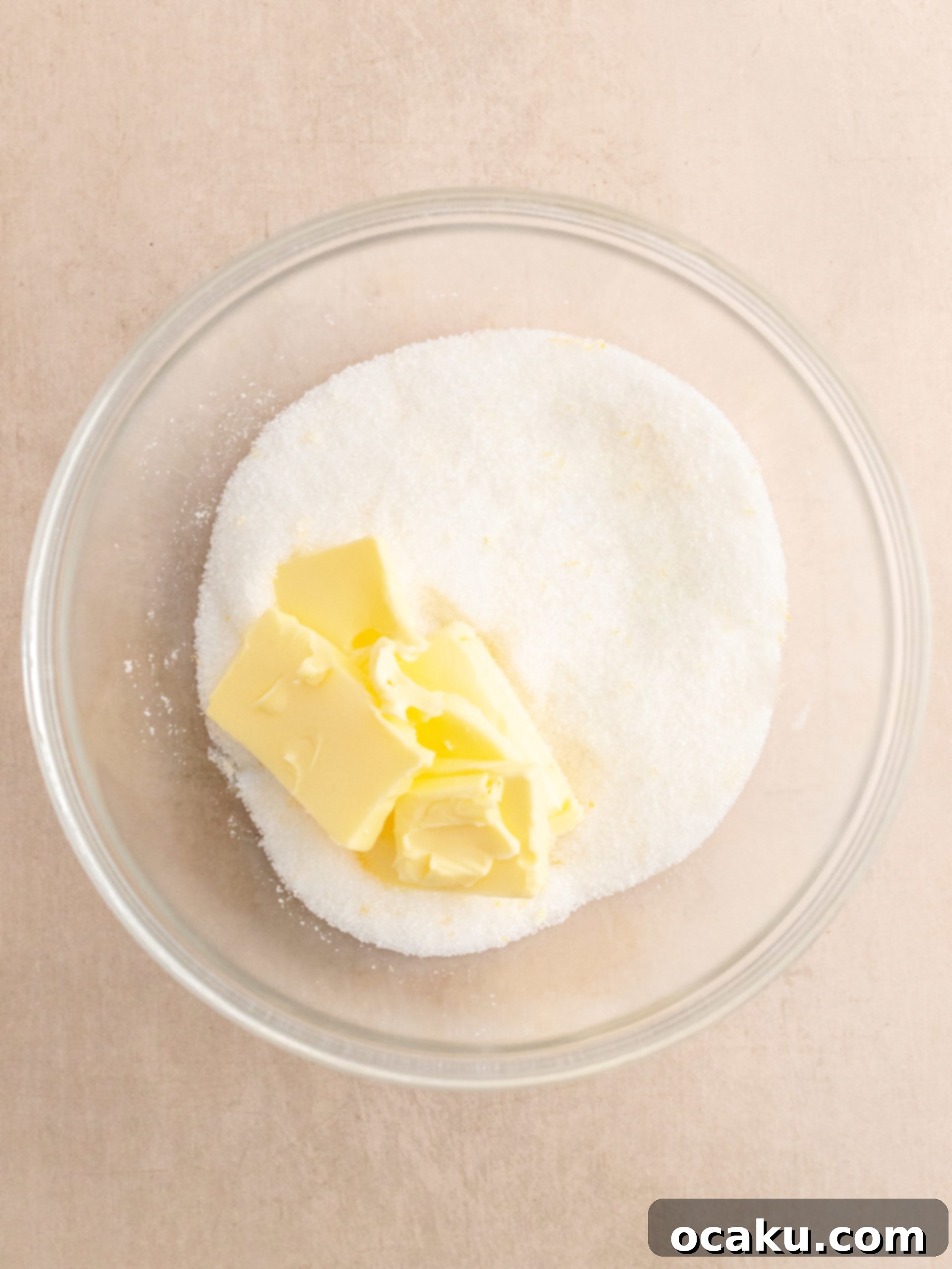 Granulated sugar and butter being creamed in a stand mixer.