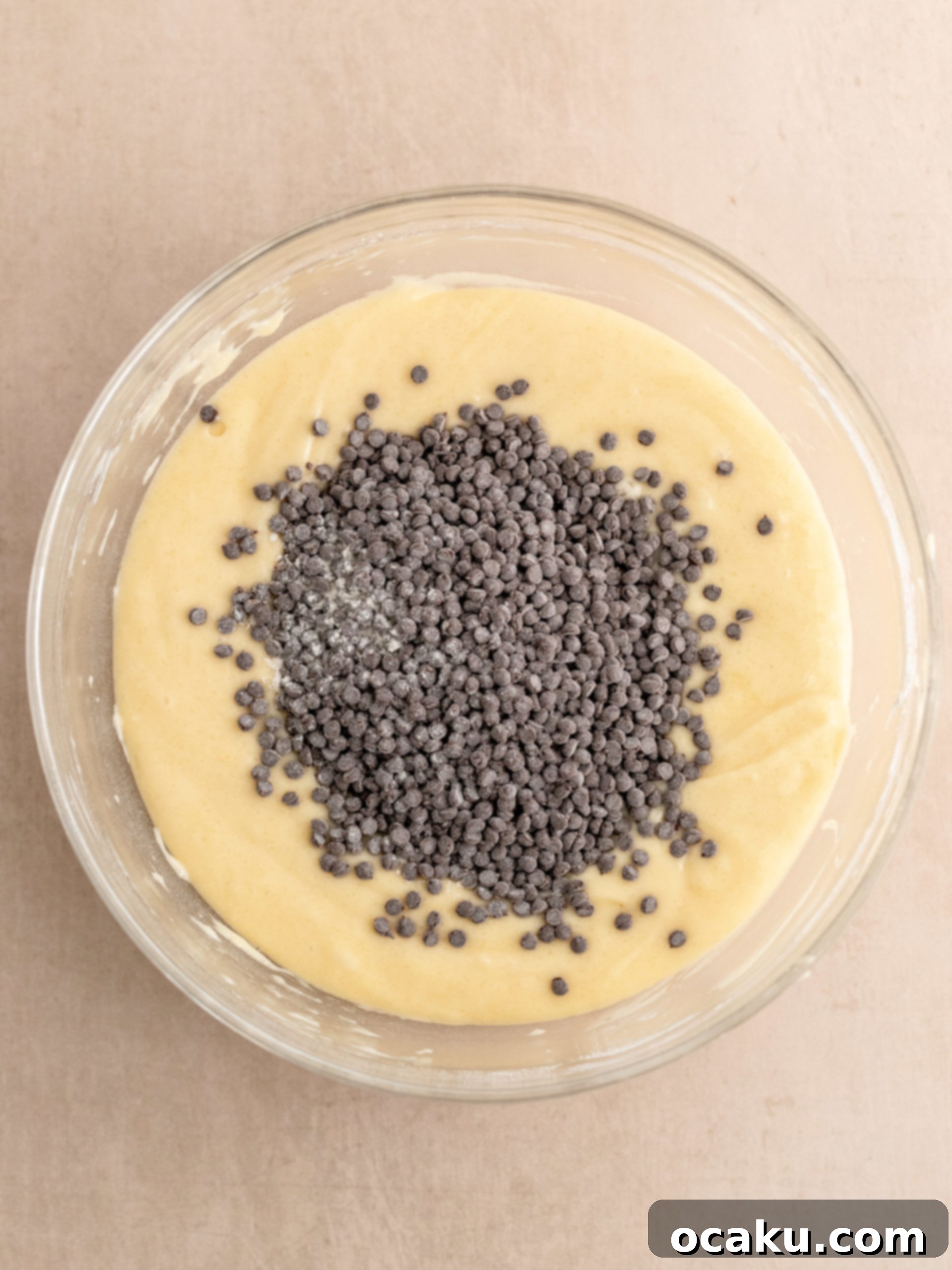 Flour mixture being gently folded into the cake batter.