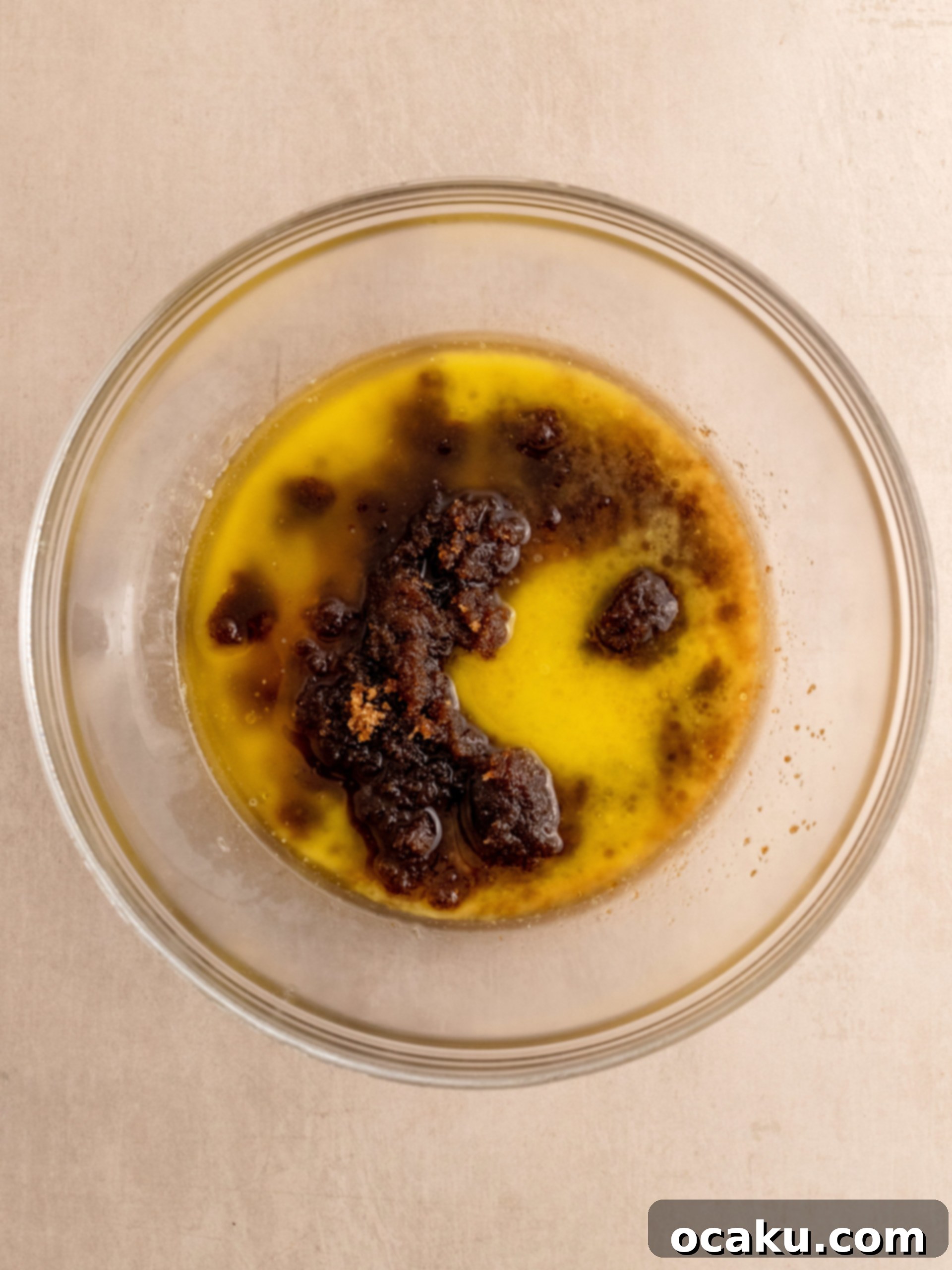 Melting butter in a saucepan for Oreo Chocolate Chip Cookies.