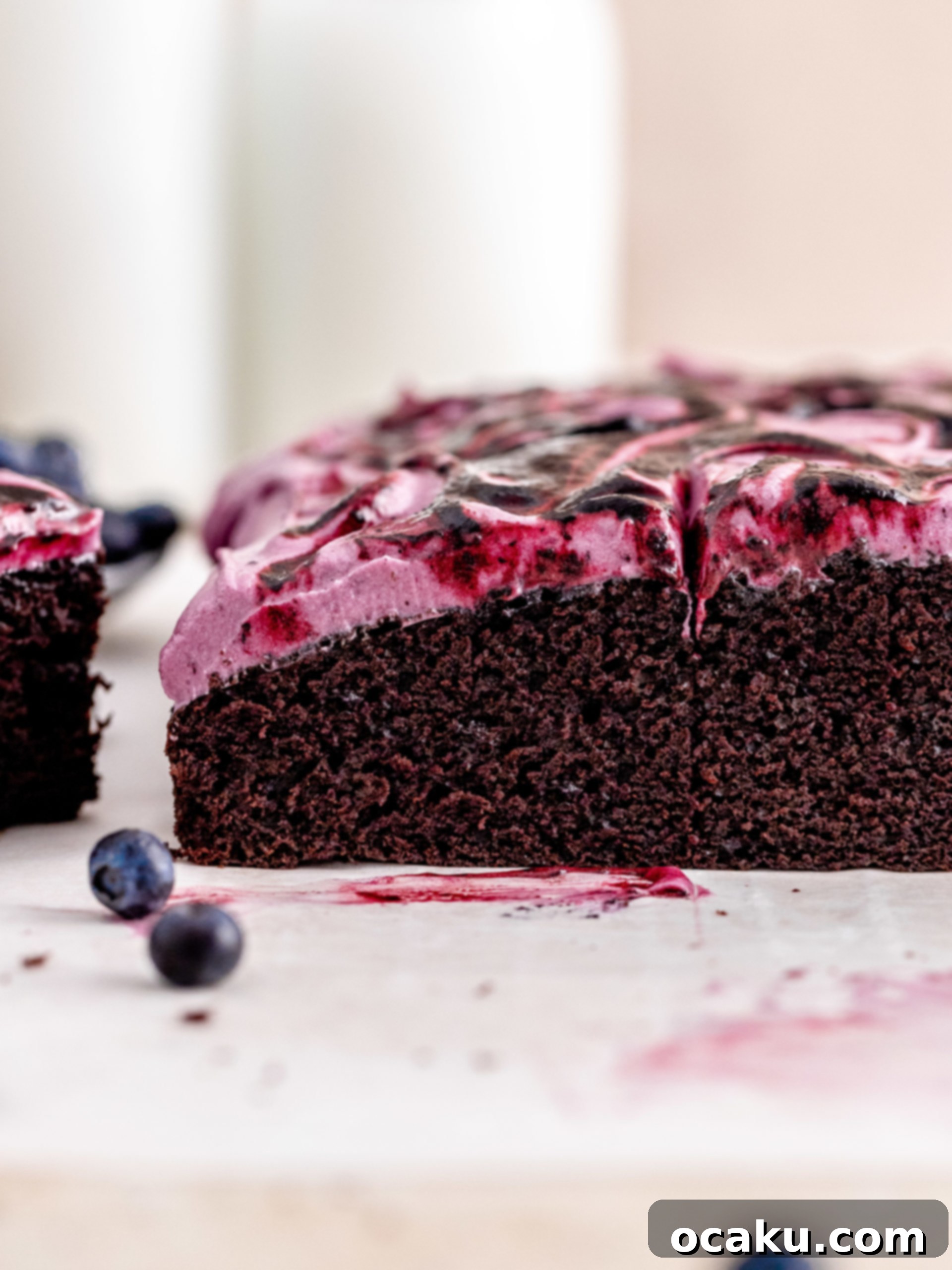 Aperol Spritz Cheesecake Close-up of fluffy Blueberry Chocolate Cake with purple frosting