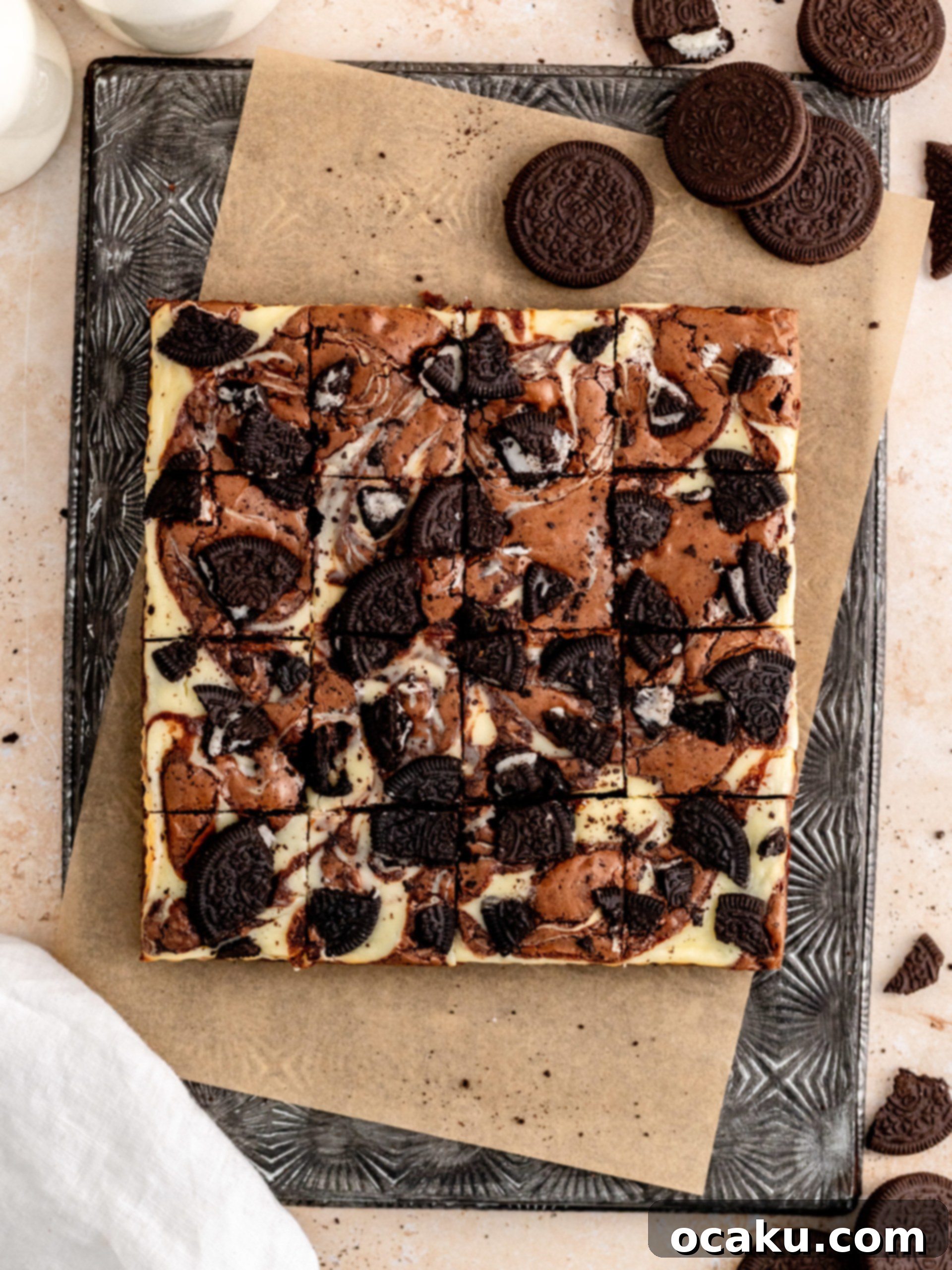Freshly baked Oreo Cheesecake Brownies cut into perfect squares, showcasing the fudgy texture and cheesecake swirl.