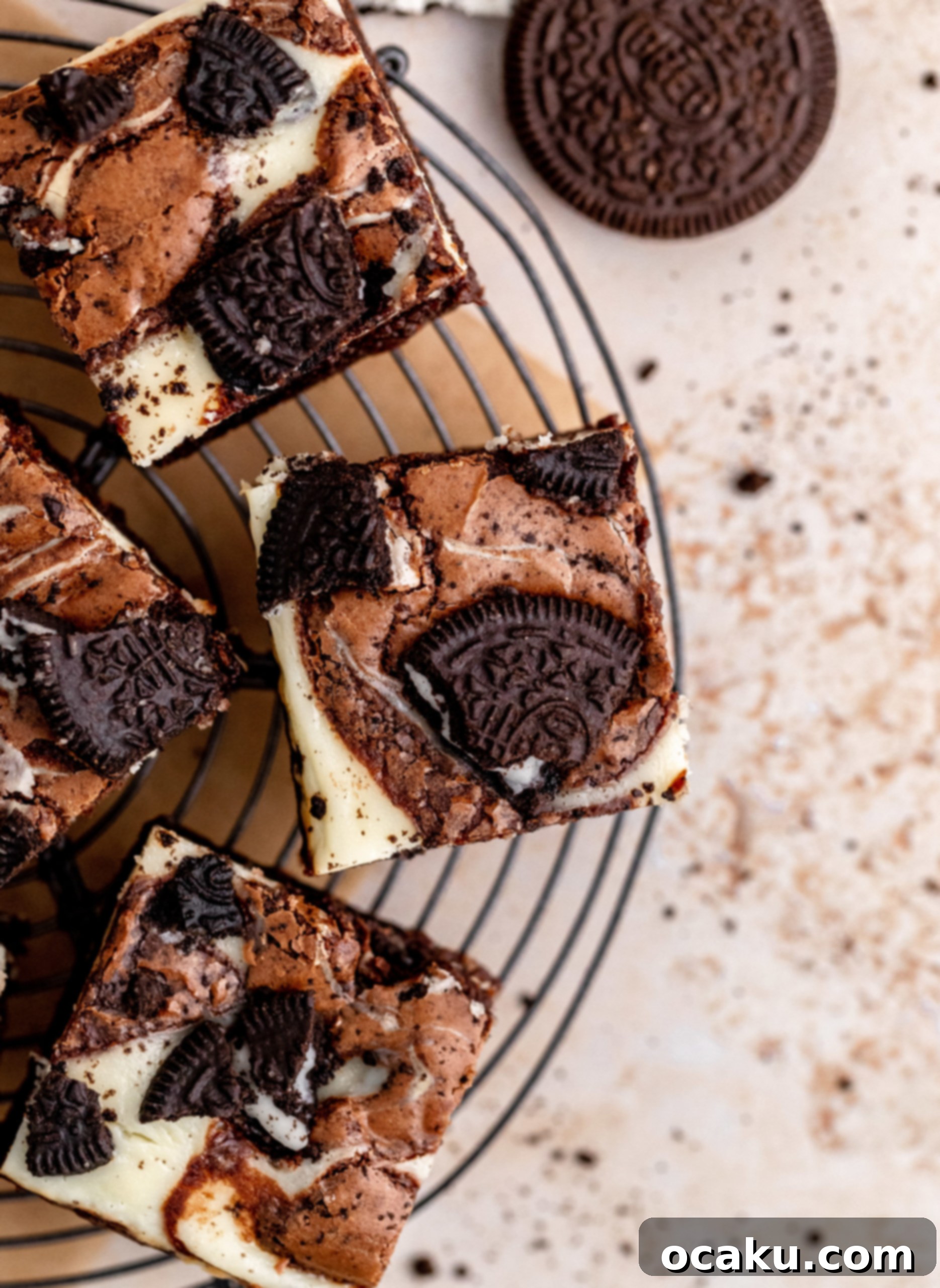 An entire pan of chilled Oreo Cheesecake Brownies, ready to be sliced and served.