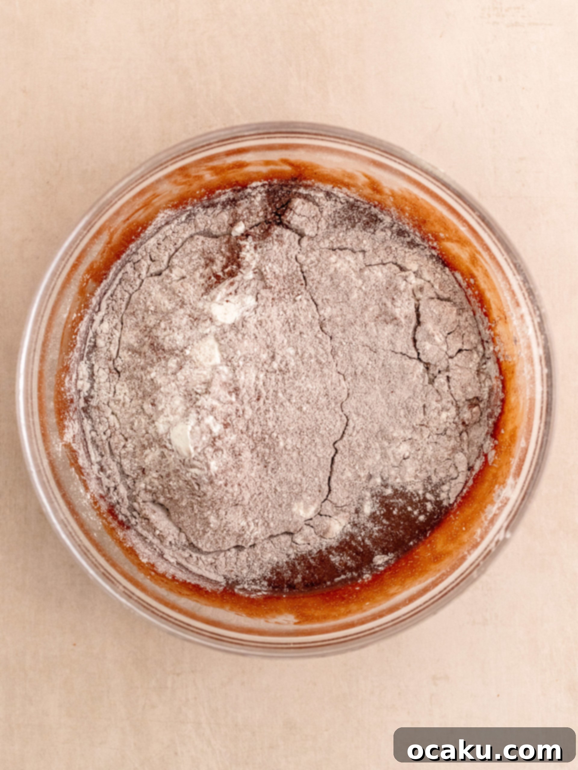 Adding vanilla extract to the brownie batter.