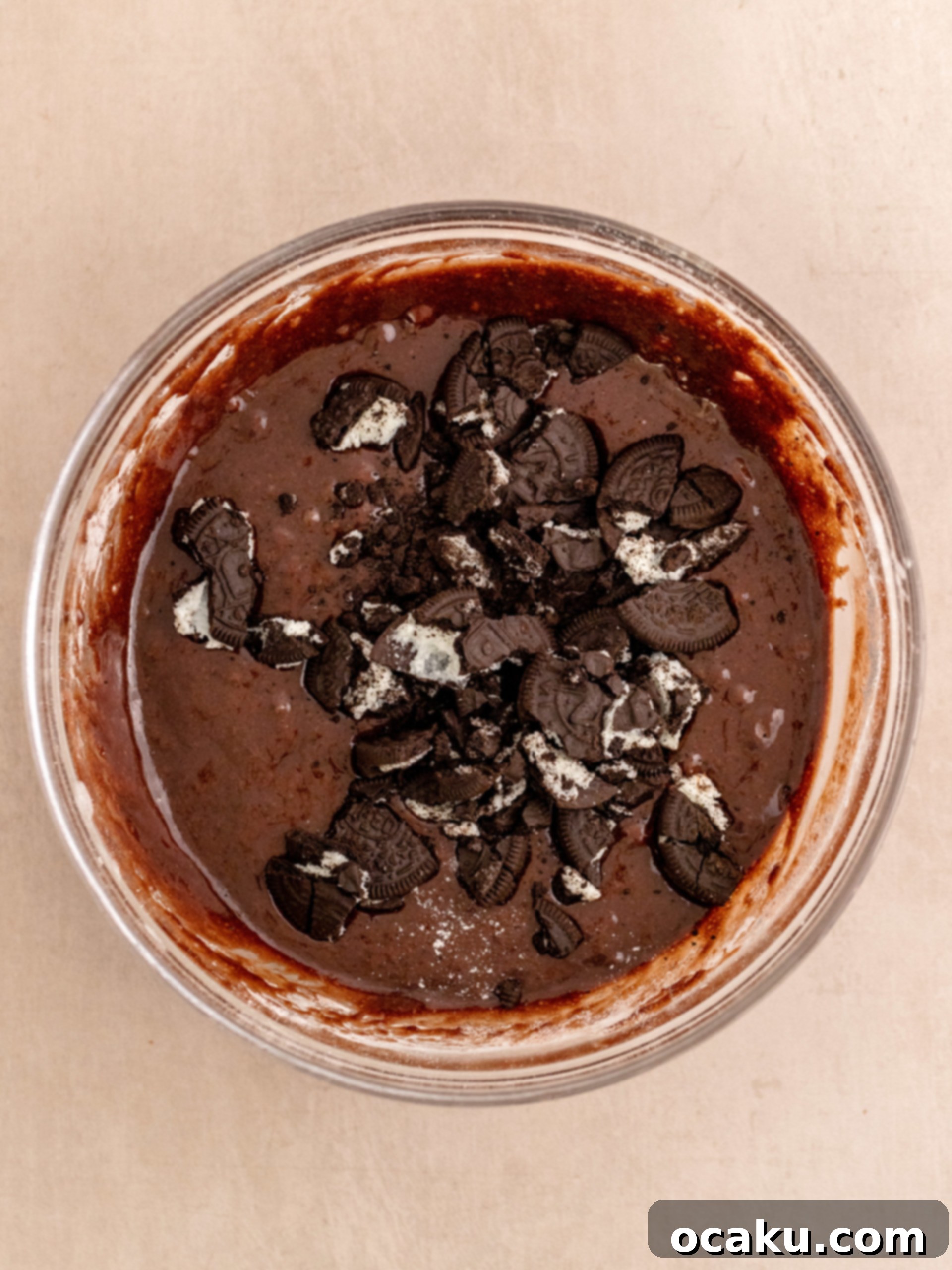 Folding crushed Oreo cookies into the rich brownie batter.