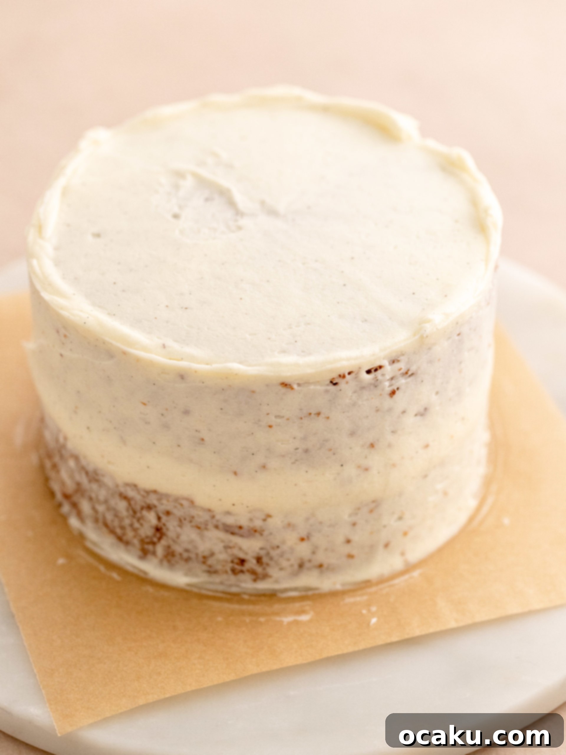 Orange and green gel food coloring mixed into separate bowls of cream cheese frosting for decoration.