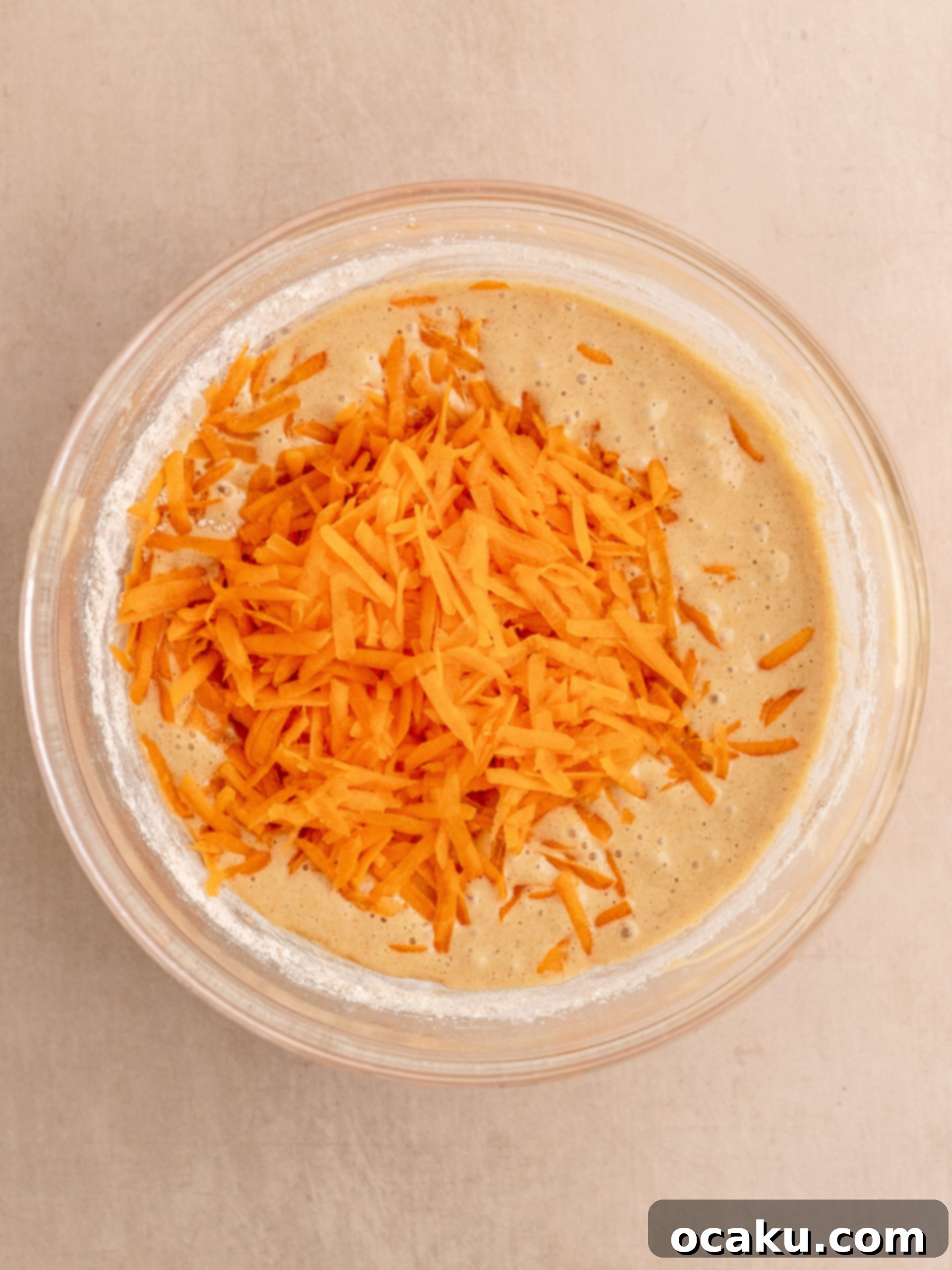 Vanilla extract added to the wet ingredients, ready for a final whisk.