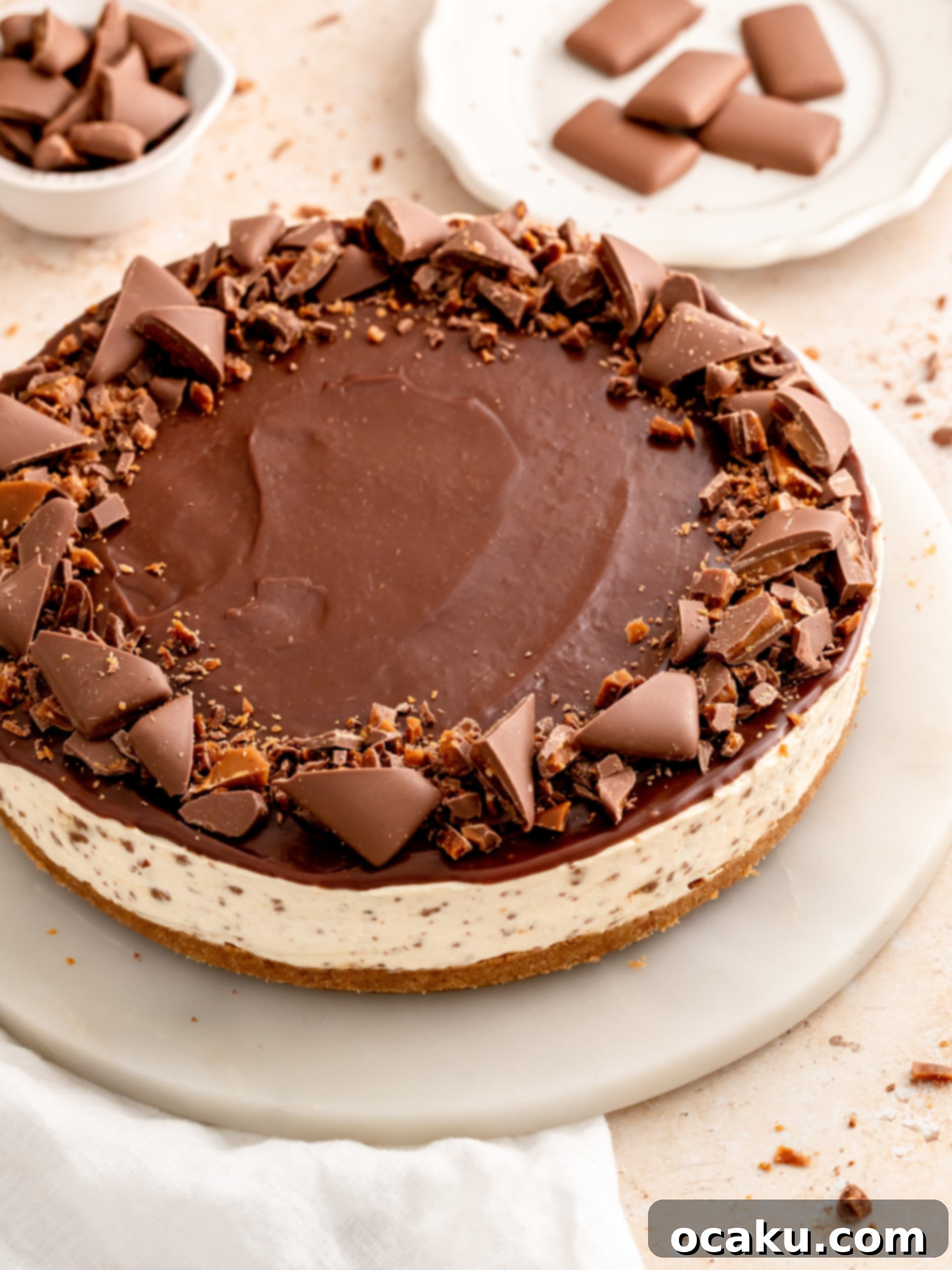 A beautifully sliced No-Bake Daim Cheesecake, ready to be served.