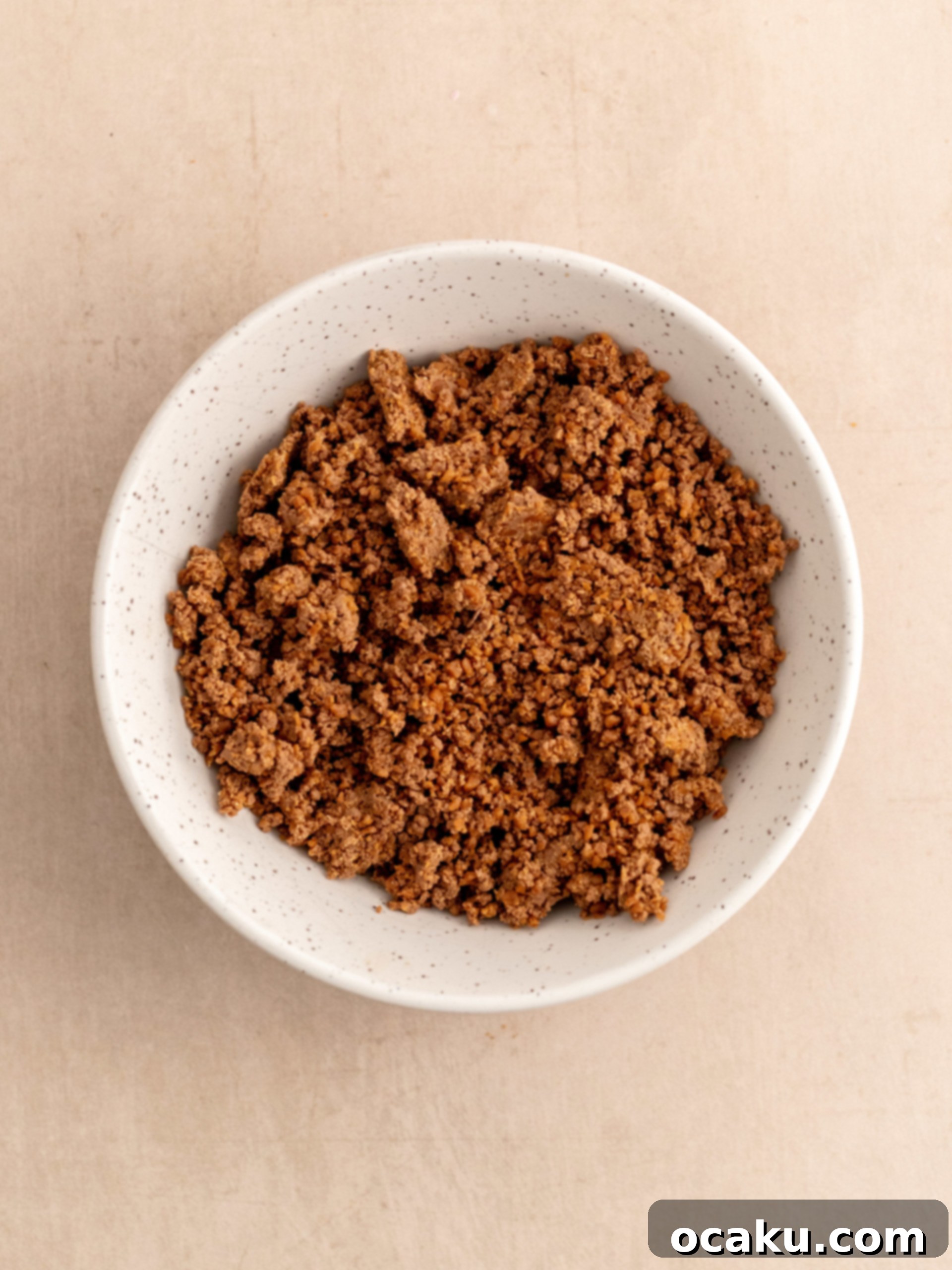 Finely crushed digestive cookies and Daim pieces for the cheesecake crust.