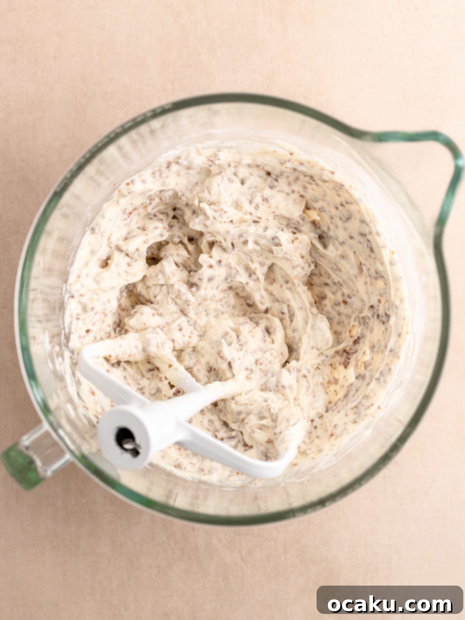 Whipped heavy cream in a bowl, showing stiff peaks.