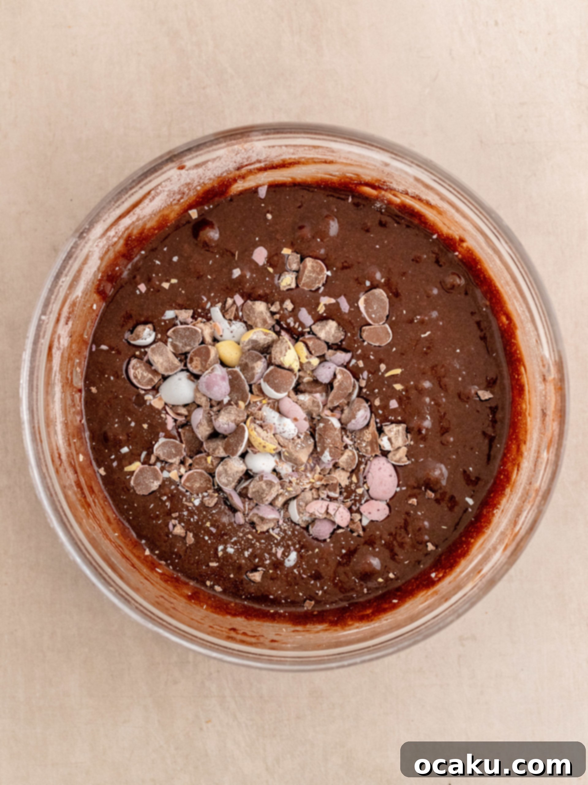 The brownie batter, now with Mini Eggs folded in, ready to be poured into the baking pan.