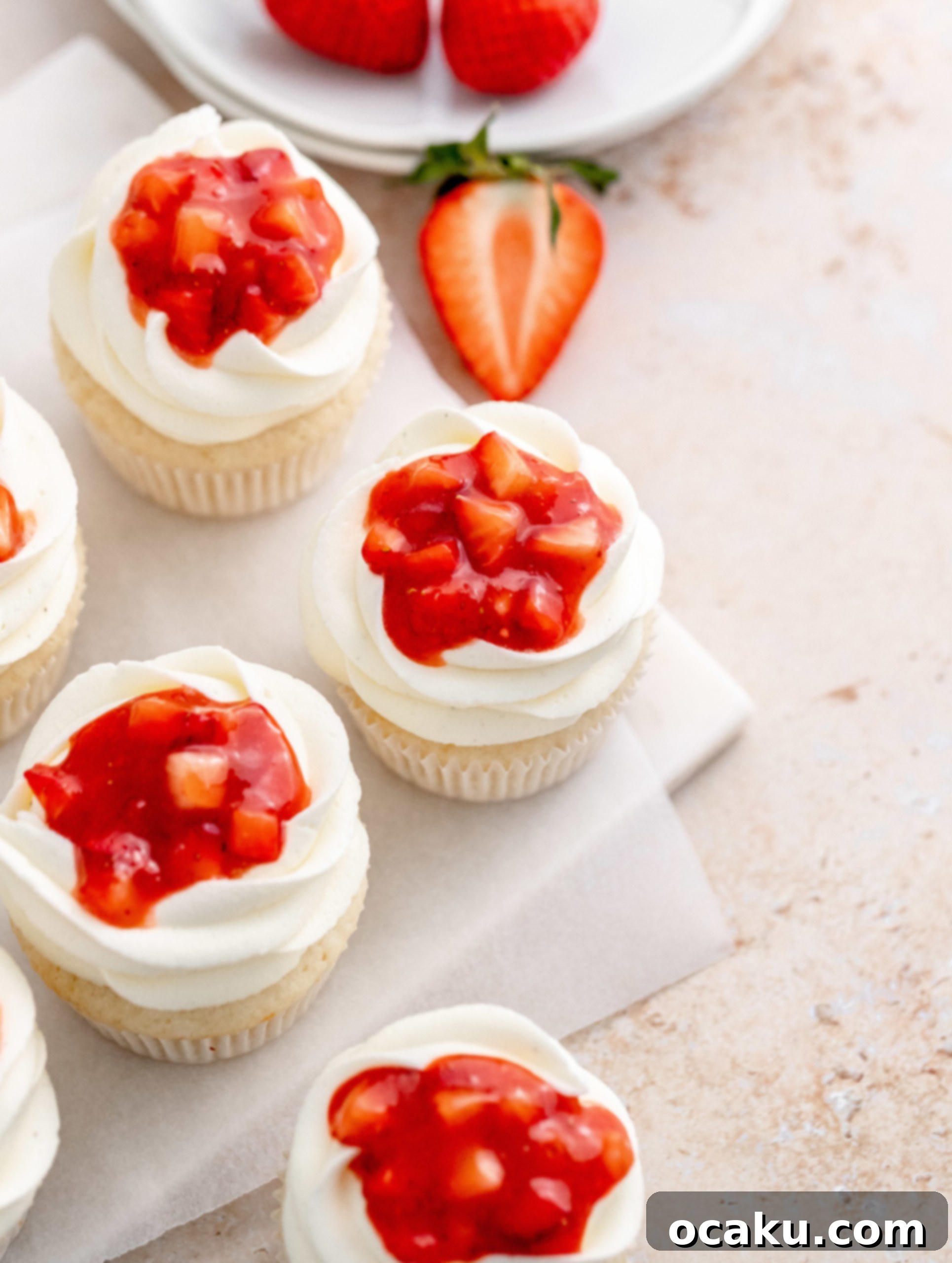 Sweet Strawberry Vanilla Cupcakes 12 Piping buttercream onto cupcakes and filling with compote