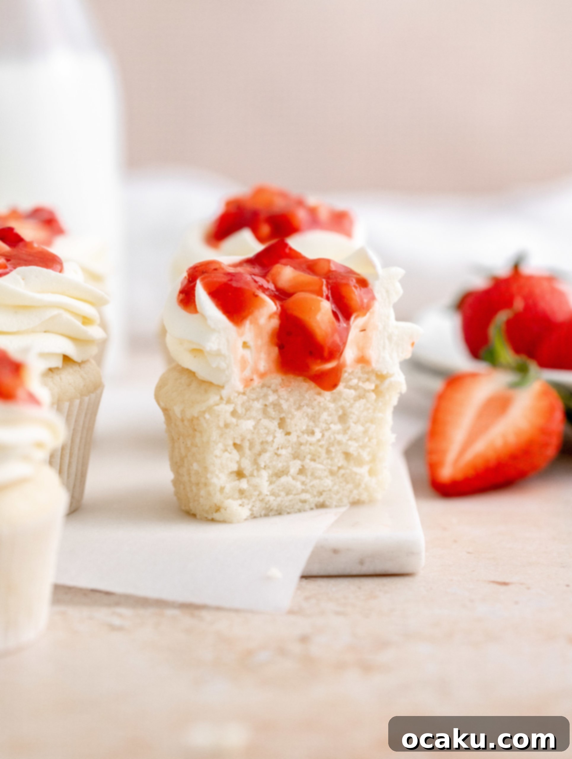 Sweet Strawberry Vanilla Cupcakes 13 Finished strawberry vanilla cupcakes decorated with buttercream and compote