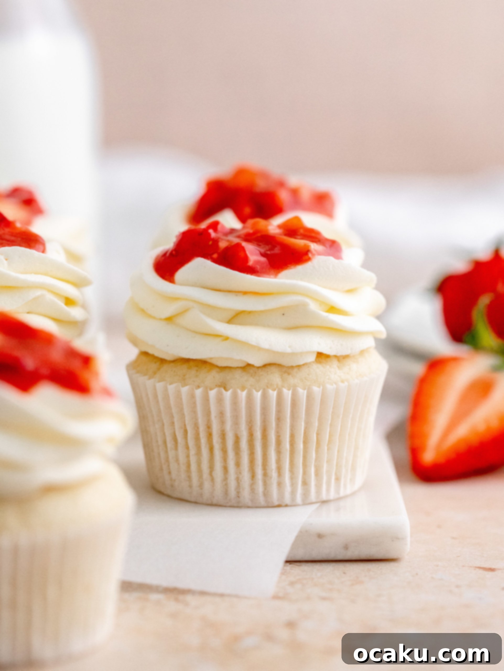 Aperol Spritz Cheesecake Close-up of baked cupcakes before frosting, showing their soft texture.