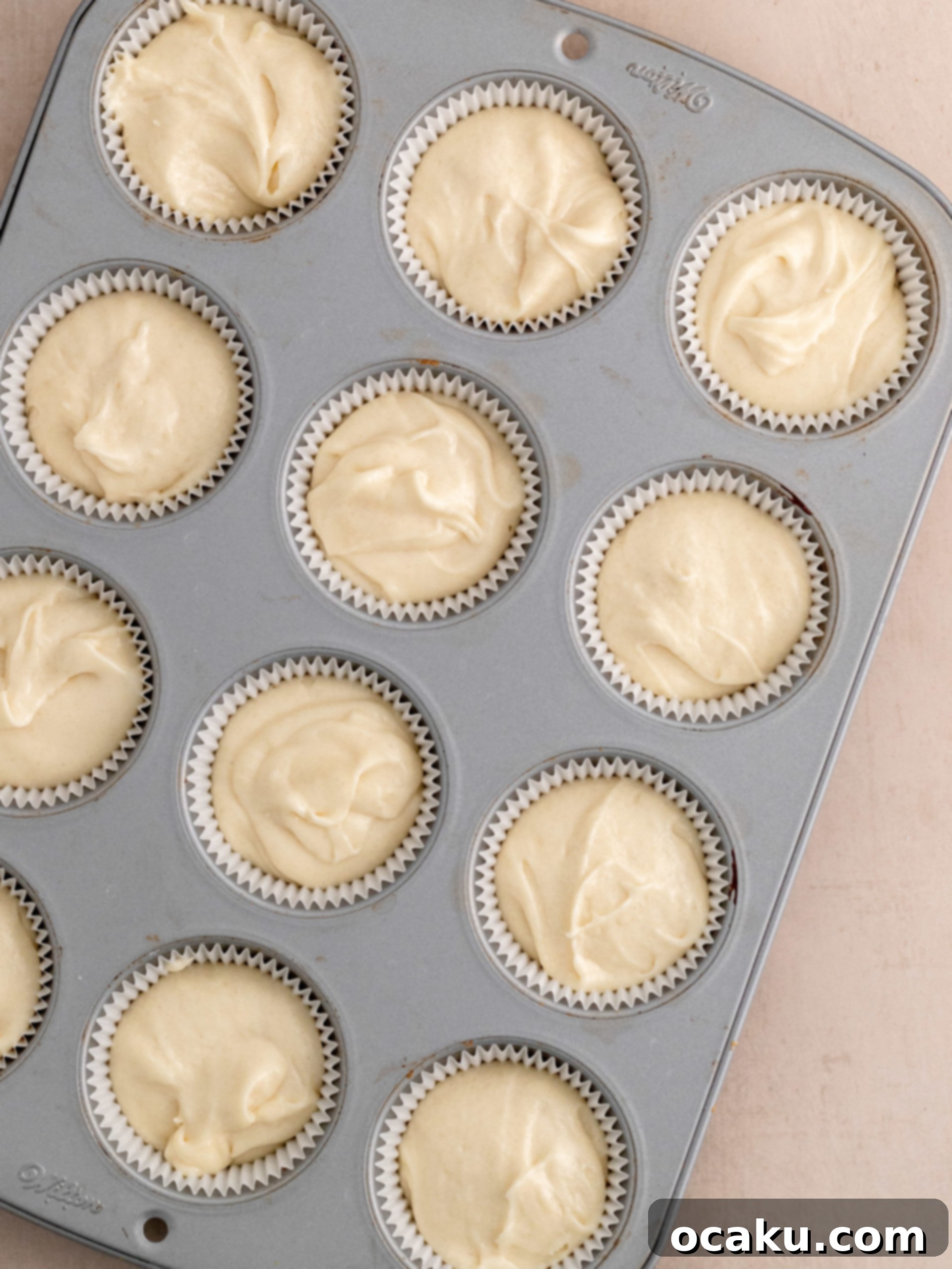Sweet Strawberry Vanilla Cupcakes 7 Cupcake batter in lined cupcake pan