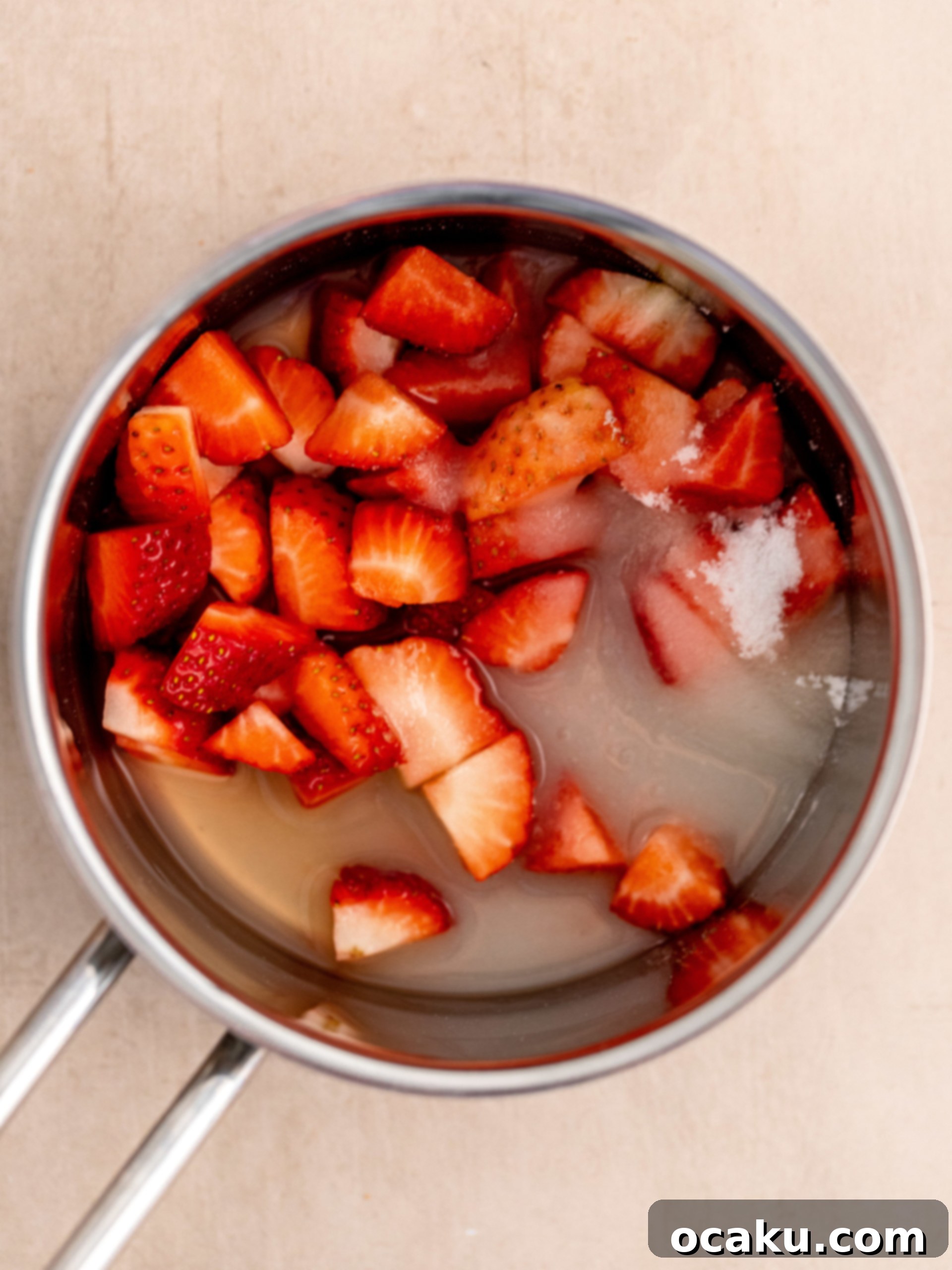 Sweet Strawberry Vanilla Cupcakes 9 Strawberry compote simmering in a pot
