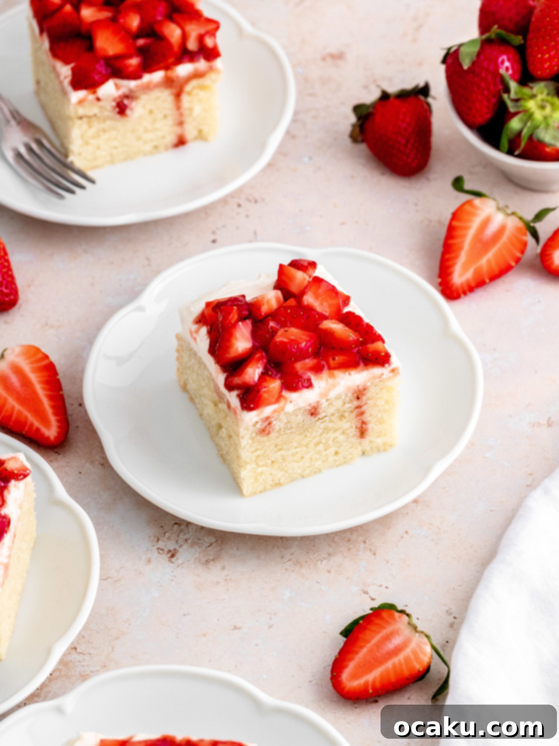 A beautifully decorated Strawberry Vanilla Cake, ready to be served.