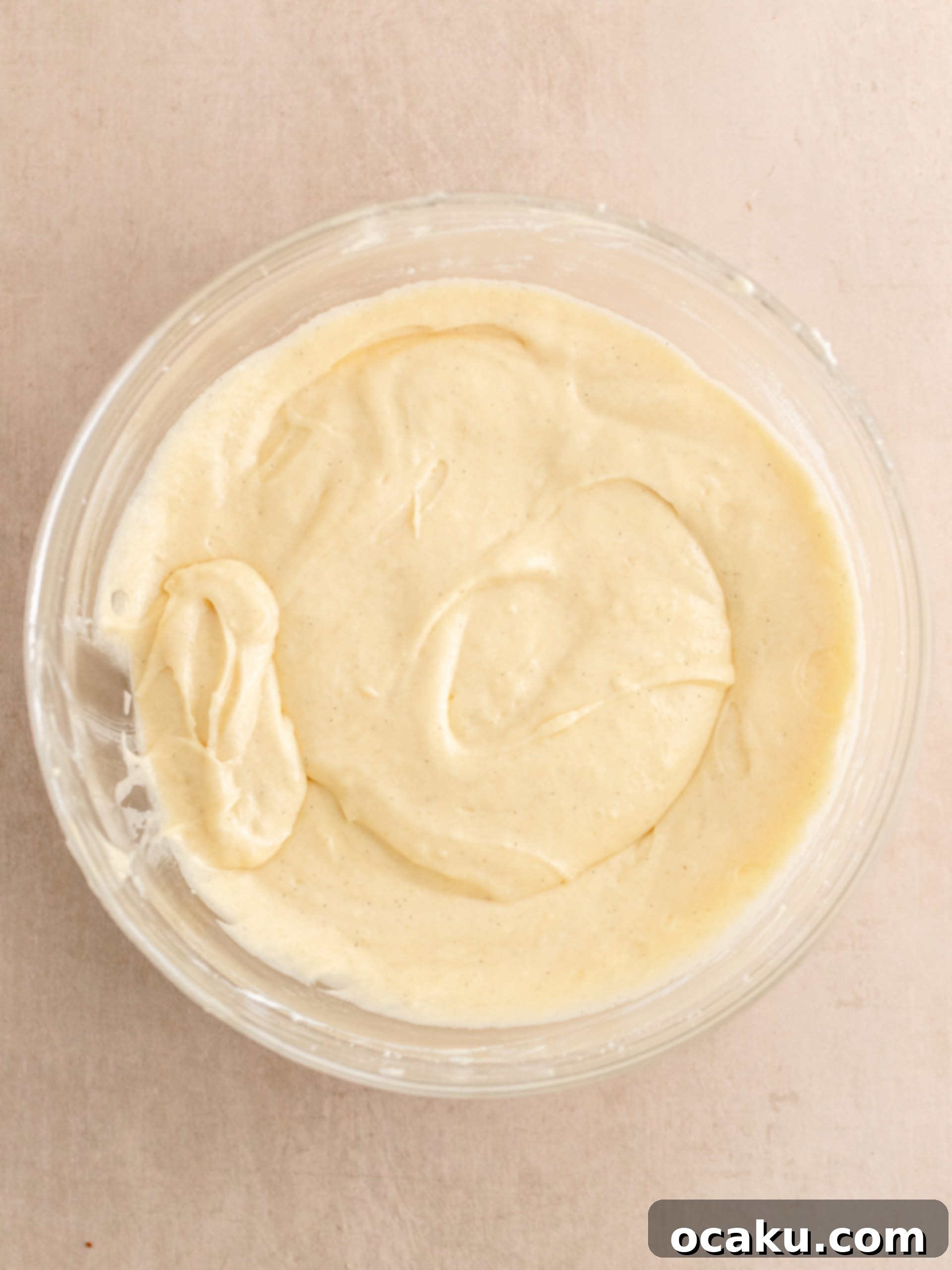 Mixing the cake batter until just combined.