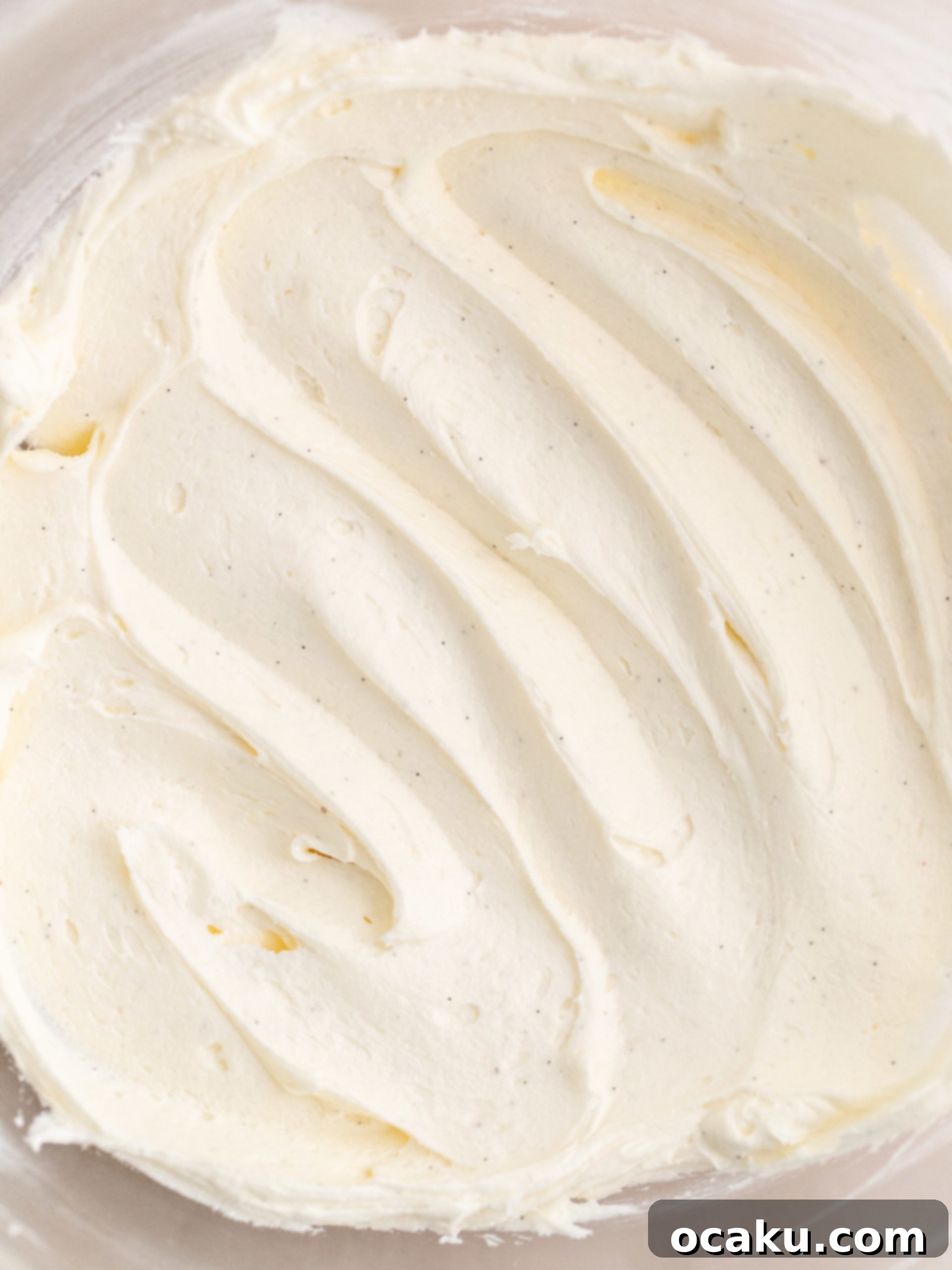 Baked vanilla cake cooling on a wire rack.
