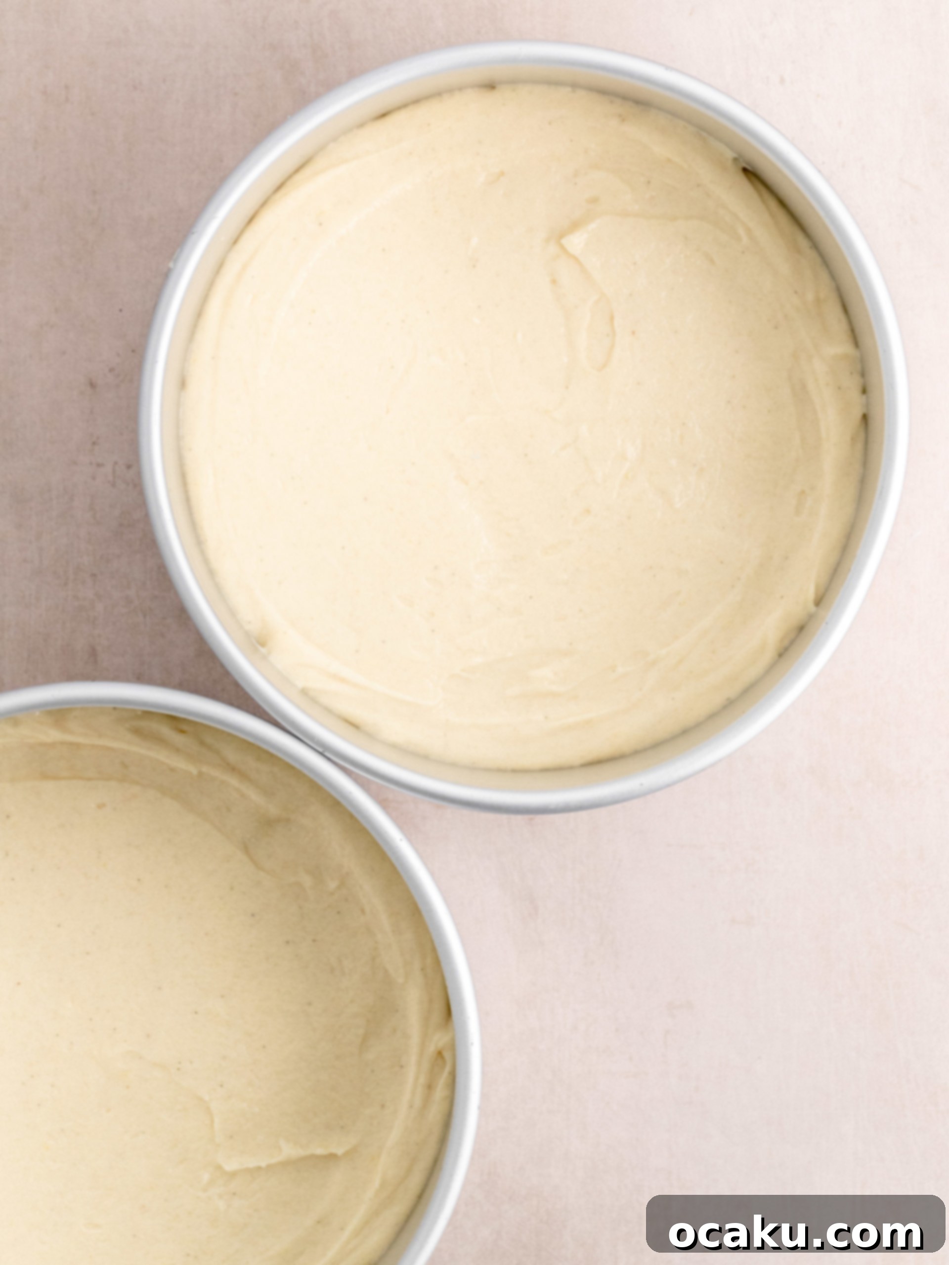 Berry Bliss Cake 7 Step 4: Dividing cake batter into baking pans.