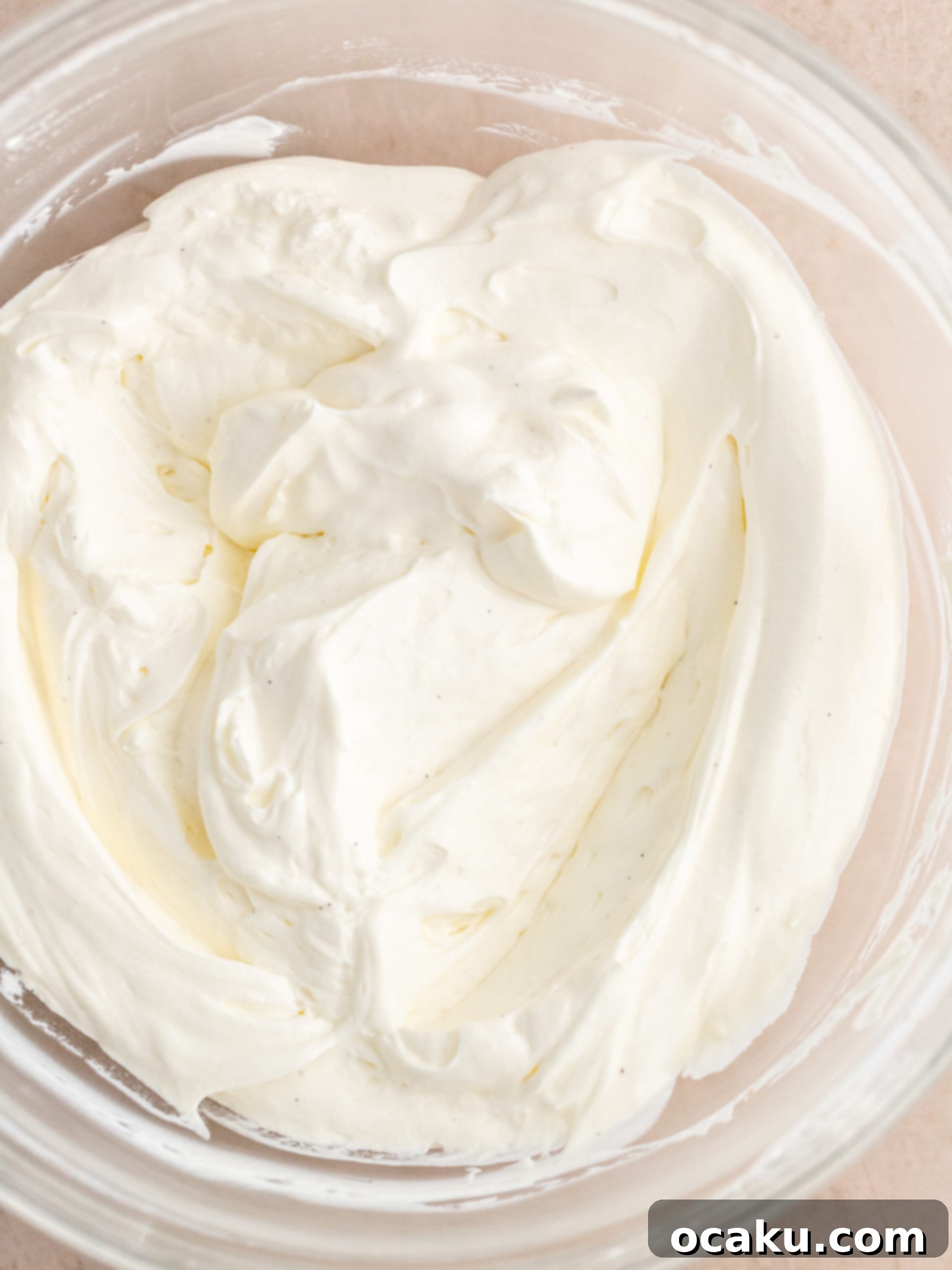 Berry Bliss Cake 9 Layering berries onto cake with mascarpone cream.