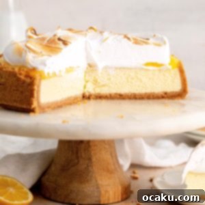 A beautifully crafted Lemon Meringue Cheesecake with toasted meringue peaks
