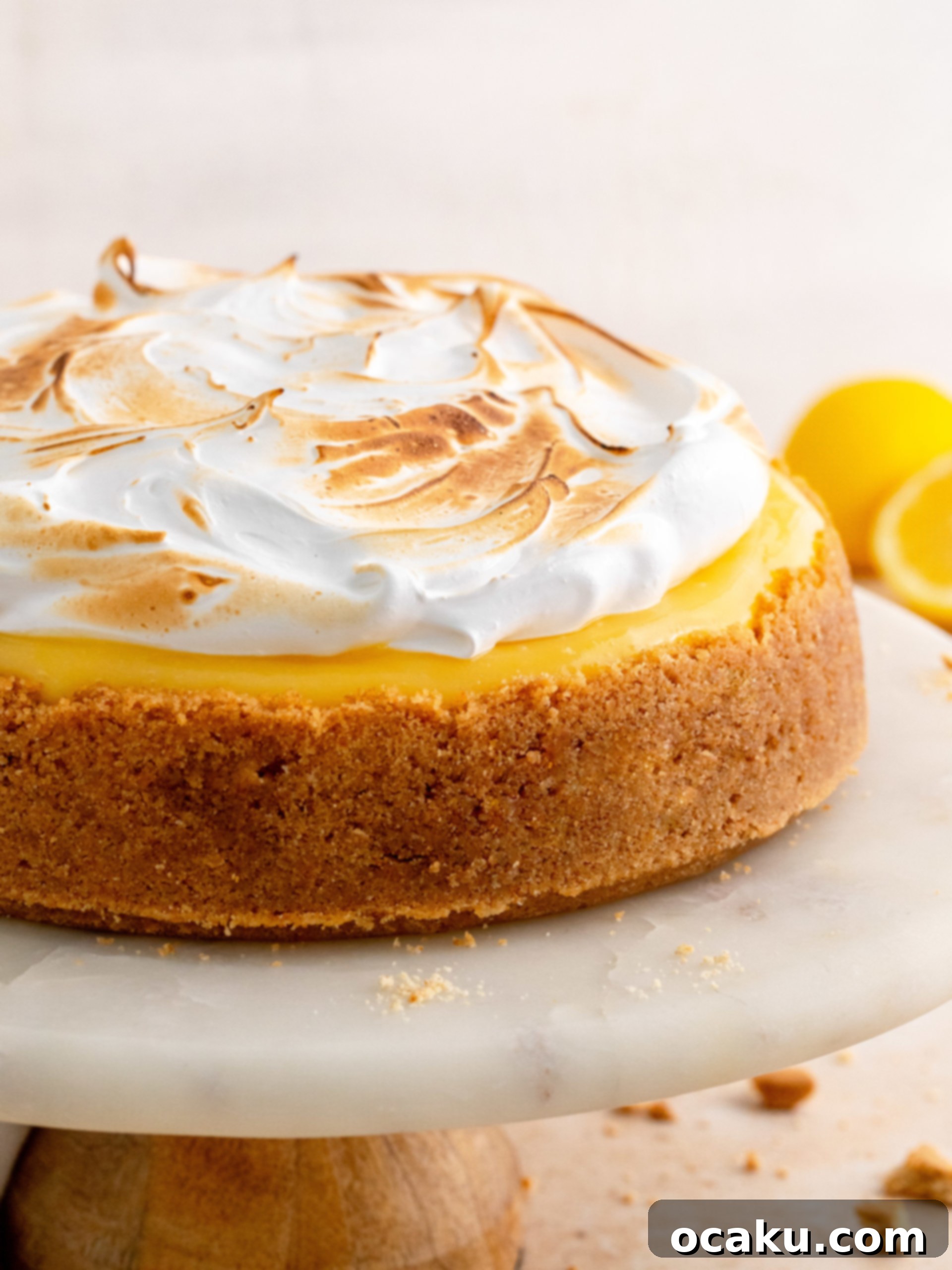 Close-up of the creamy cheesecake layer, topped with bright yellow lemon curd