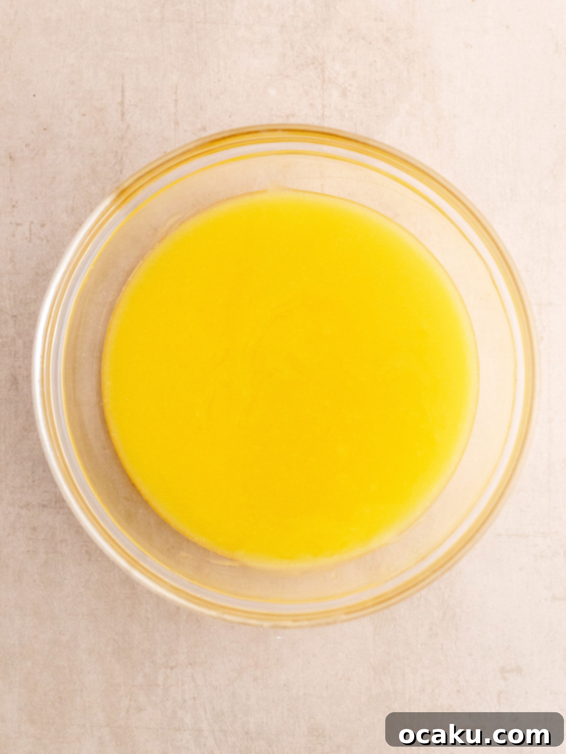 Cream cheese and sugar being mixed in a stand mixer