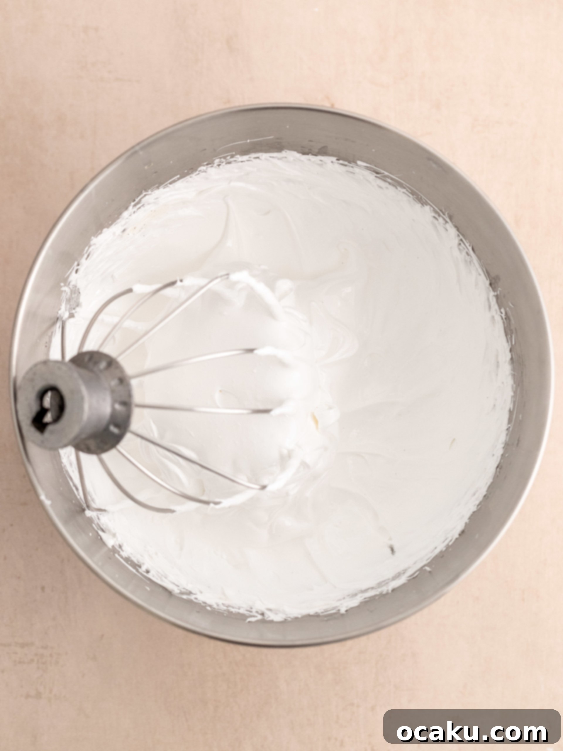 Cheesecake batter being poured into the prepared crust