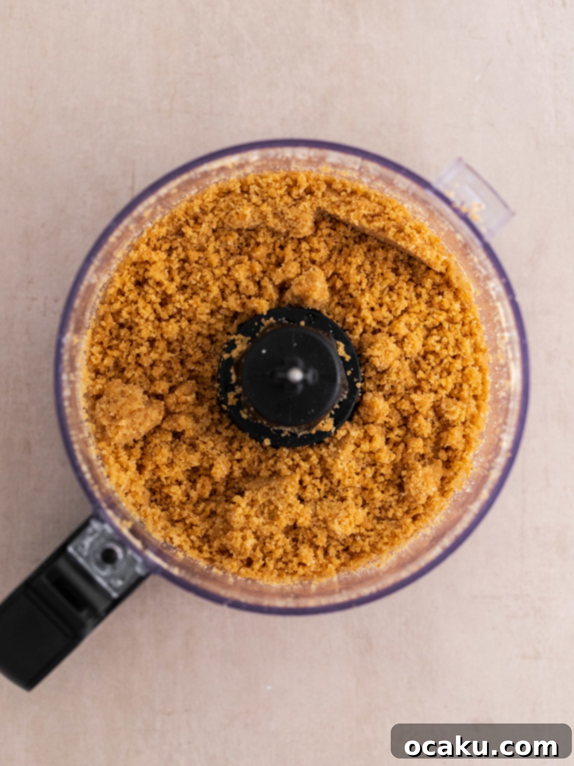 Decadent Vanilla Cheesecake 3 Close-up of vanilla bean being scraped from a pod