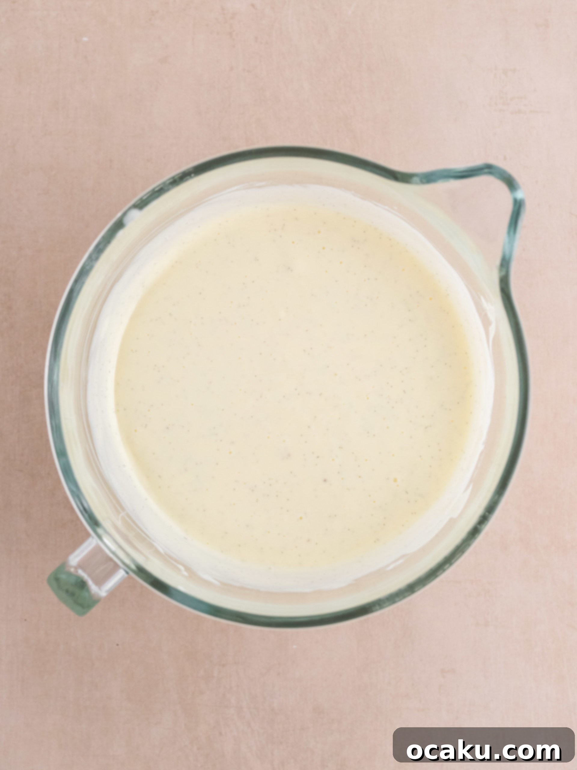 Decadent Vanilla Cheesecake 5 Mixing cream cheese and sugar in a stand mixer