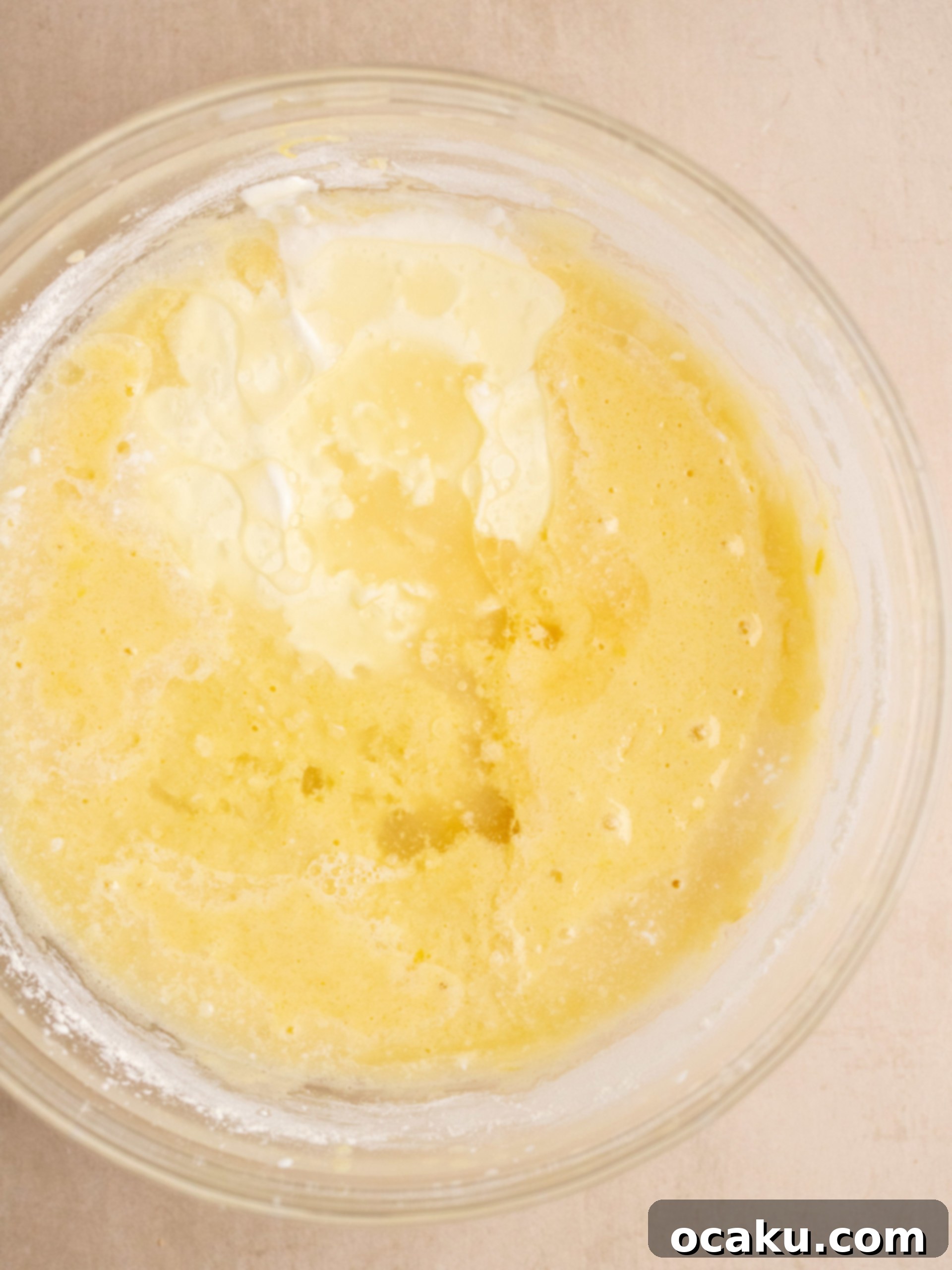 Adding dry ingredients to the wet cake batter