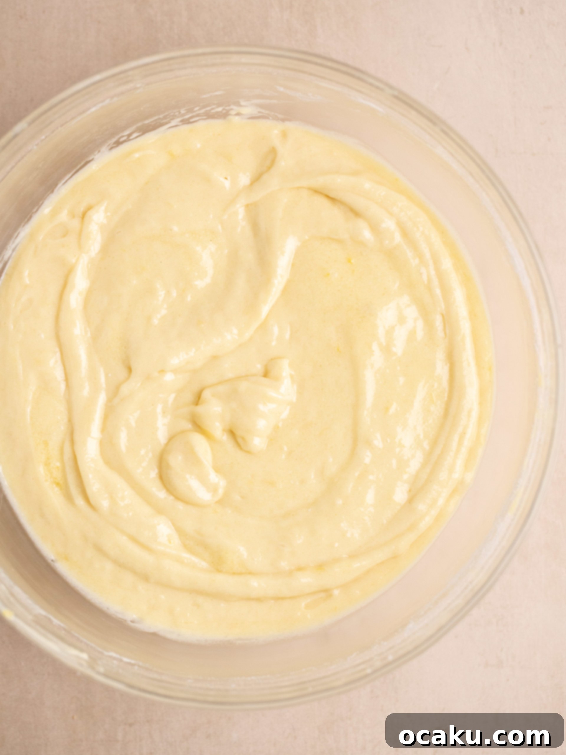 Pouring cake batter into a prepared baking pan