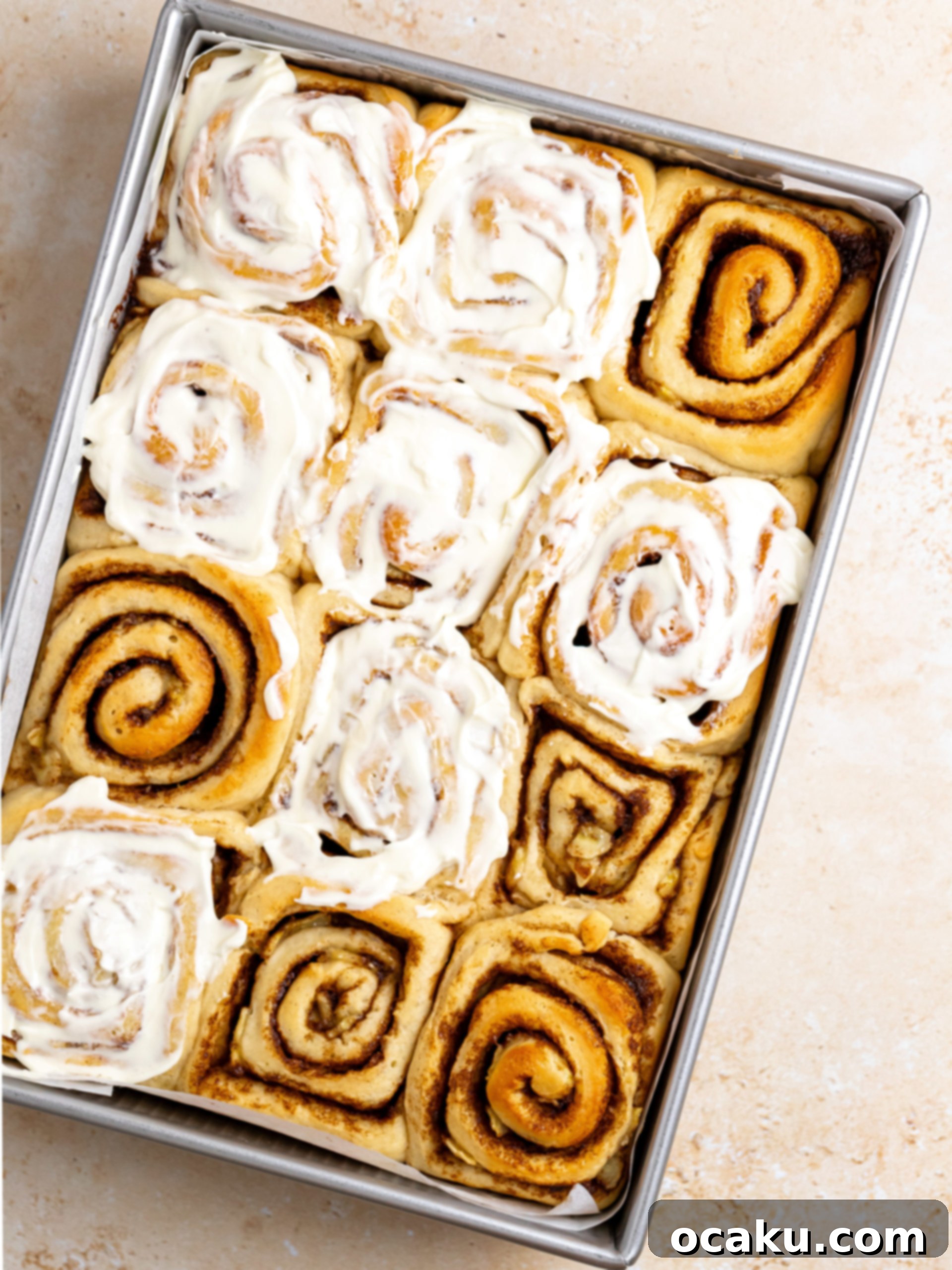 Image of cinnamon rolls cut and placed in a baking tray.