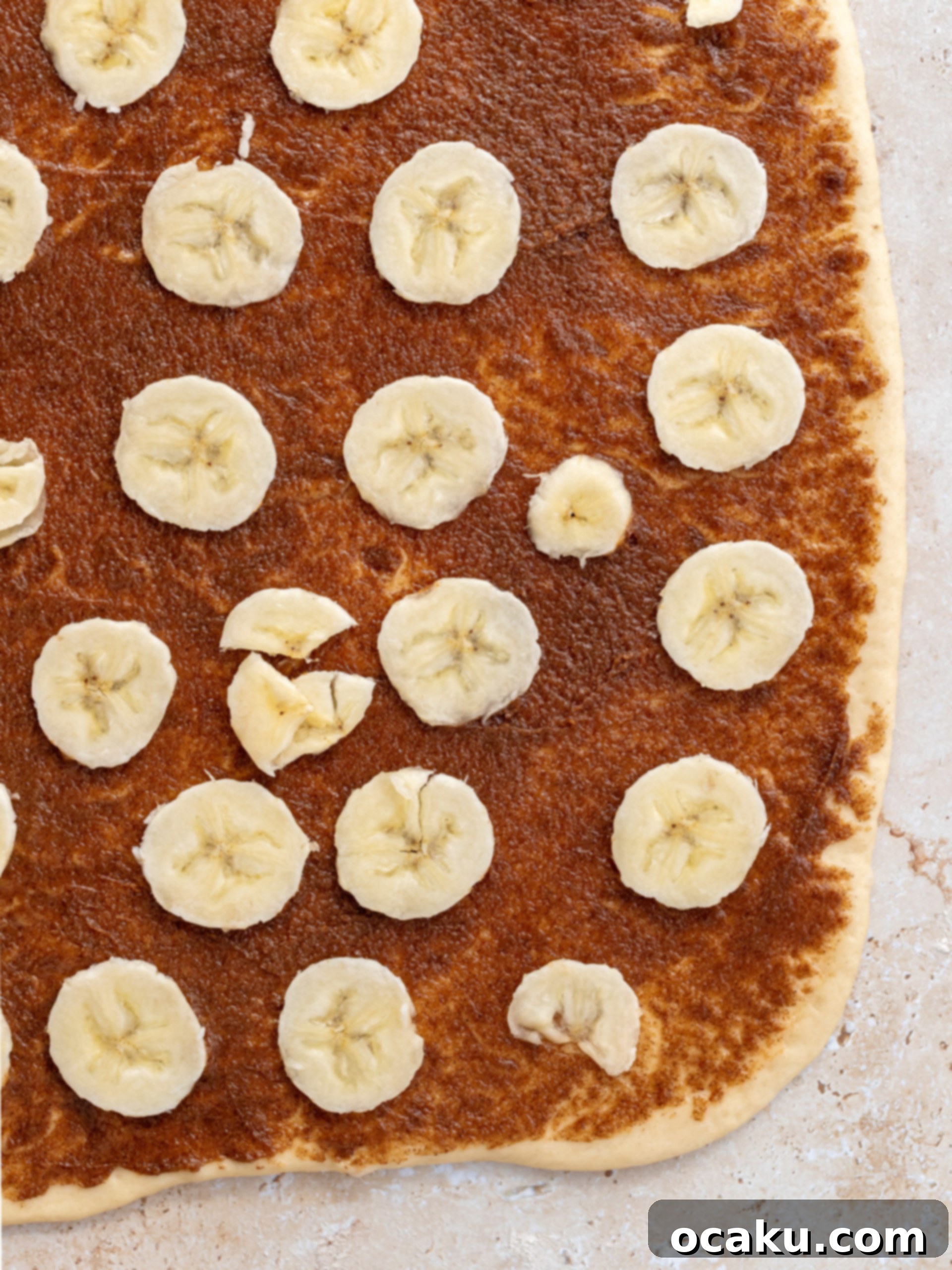 Image of dough being rolled out into a rectangle.