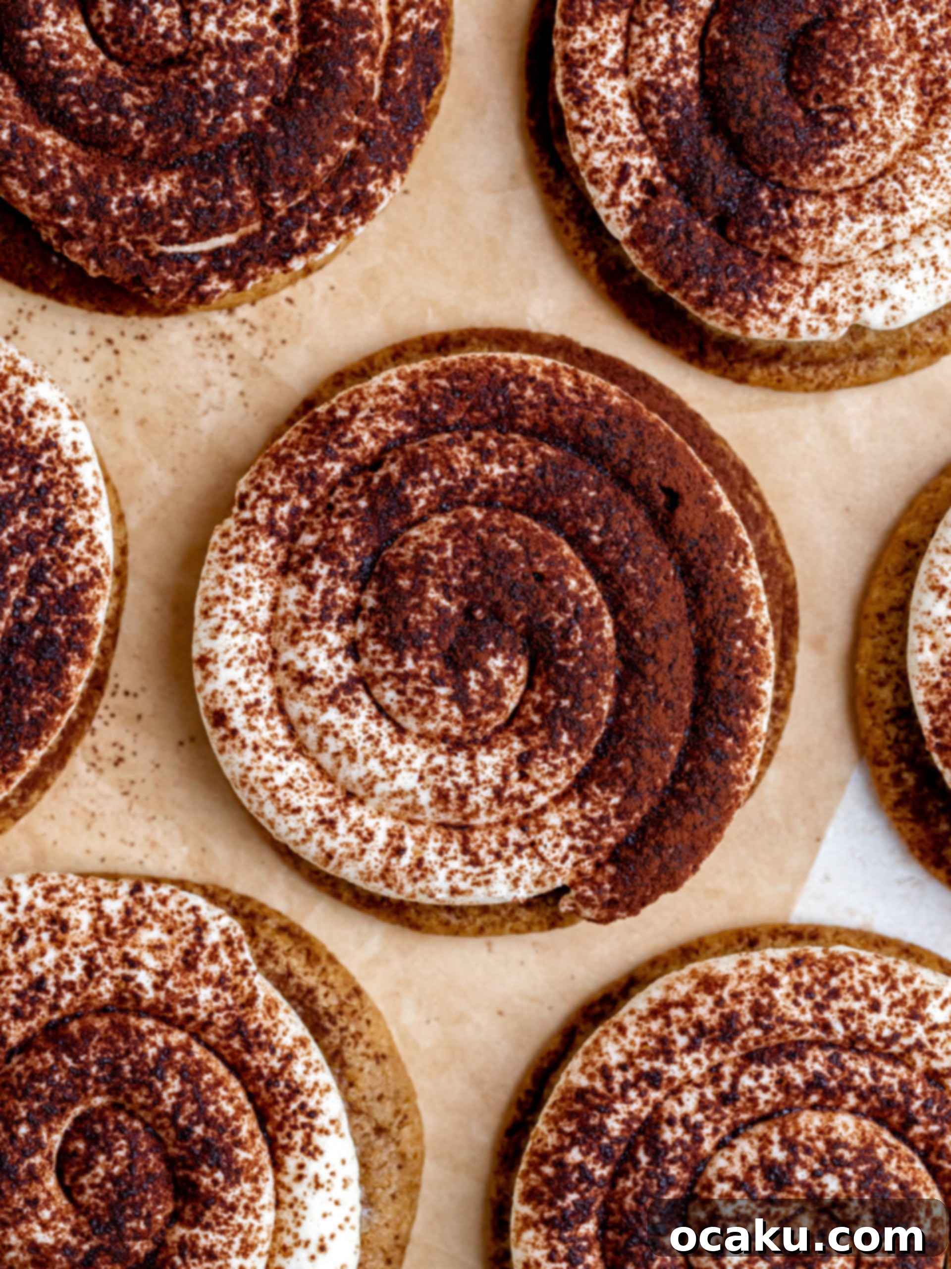 Coffee Mascarpone Cookies 2 Close-up of Tiramisu Cookies on a cooling rack, showing their coffee-infused base and creamy mascarpone topping dusted with cocoa powder.