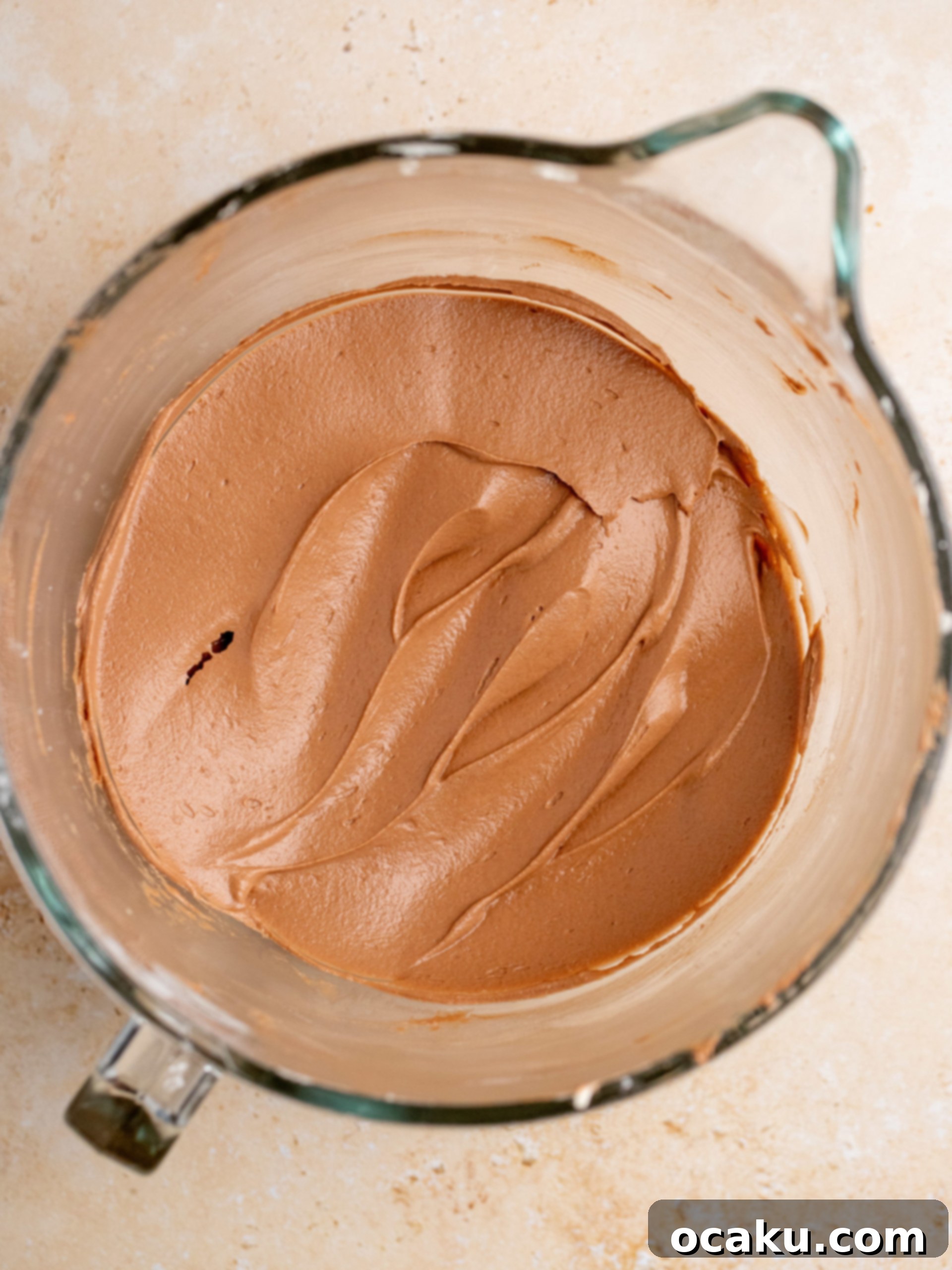Decadent Nutella Cake 8 Finishing touches of the Nutella cake with hazelnuts.