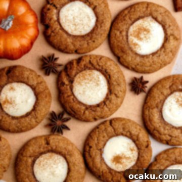 Pumpkin Cheesecake Cookies with creamy filling.
