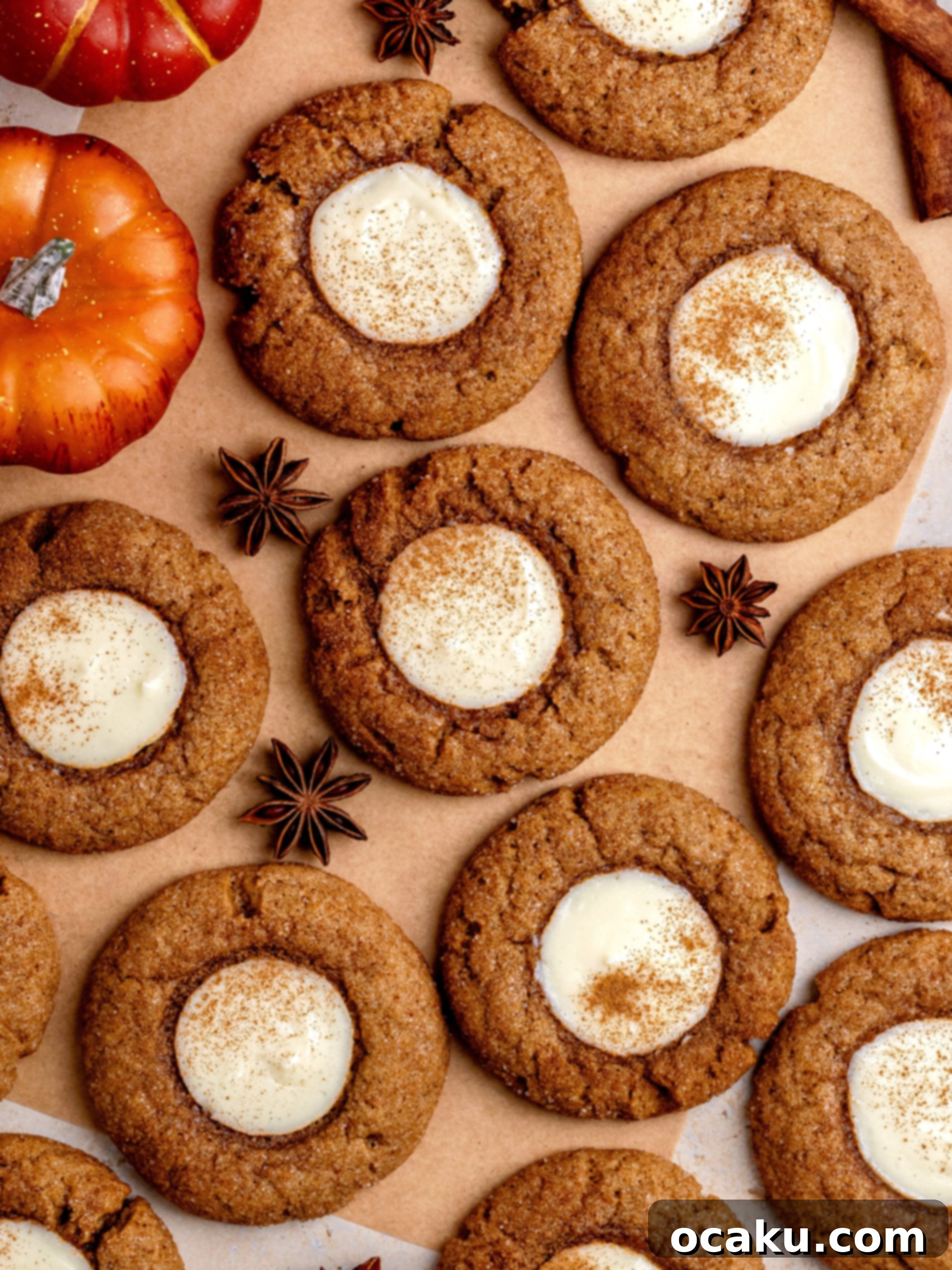 Top-down view of pumpkin cheesecake cookies on a cooling rack, highlighting their perfect round shape and golden brown color.