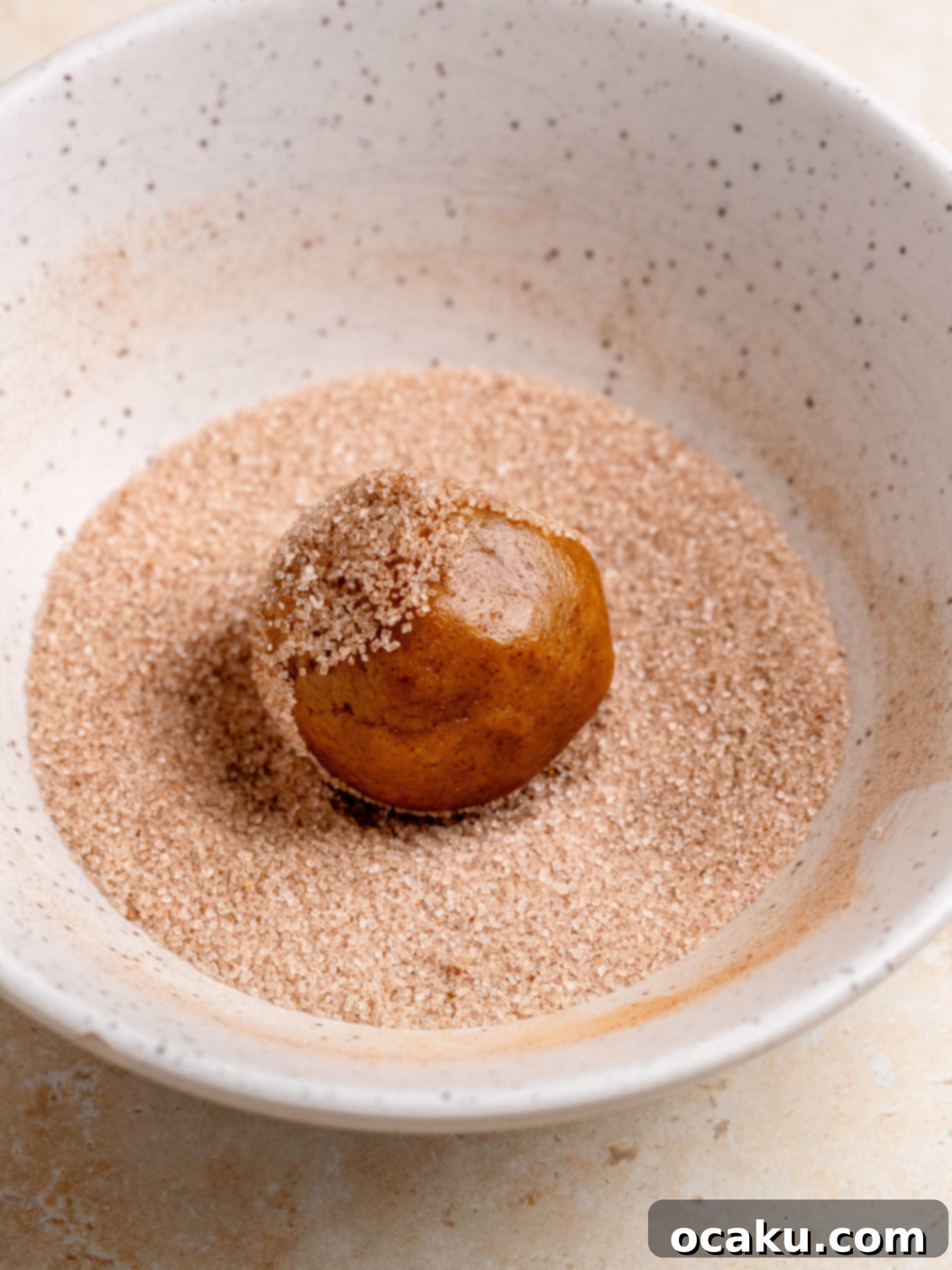 Close-up of pumpkin cheesecake cookies with filling before baking.