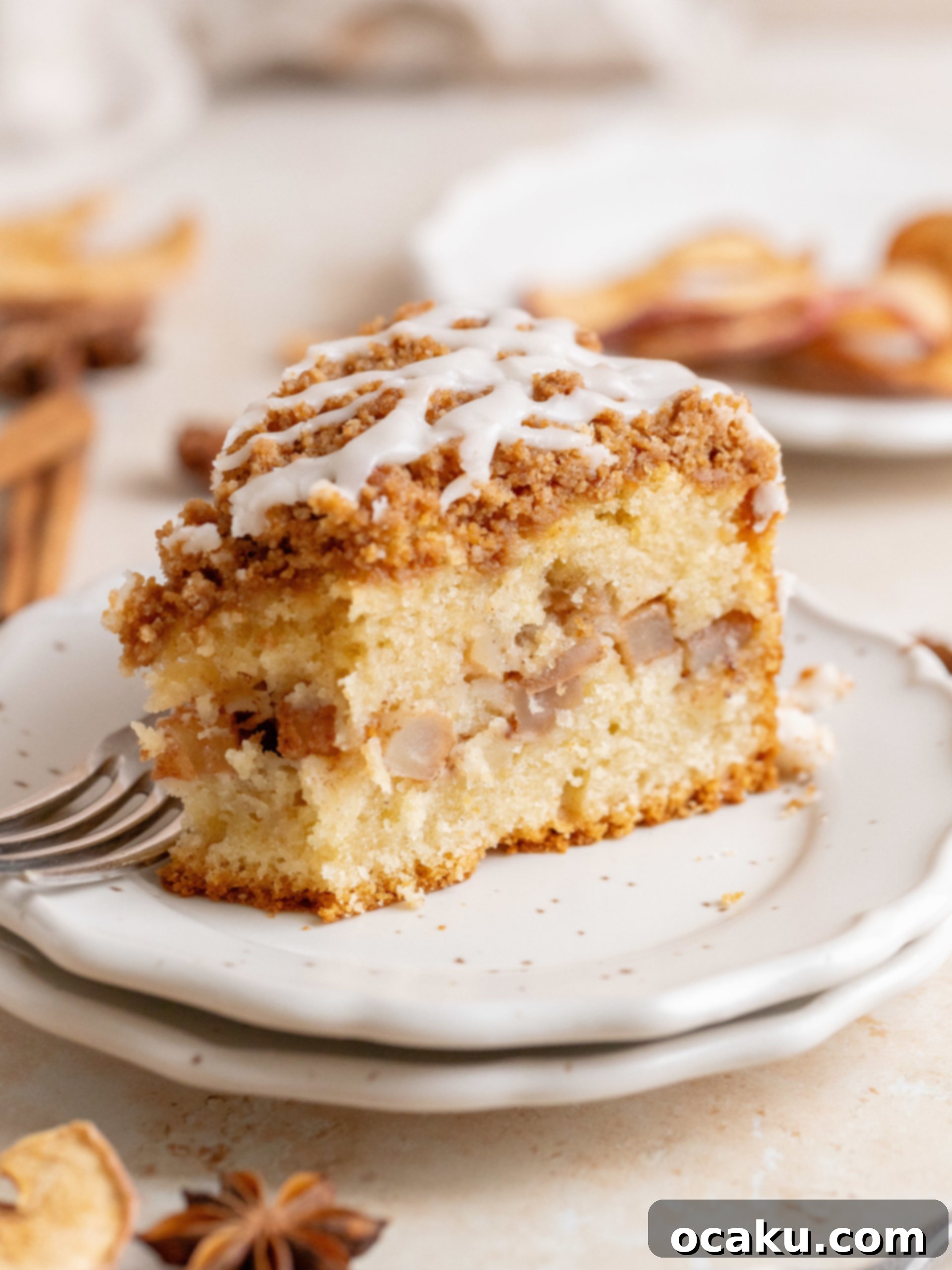 Freshly baked Apple Crumb Cake cooling on a wire rack, ready for the maple glaze.