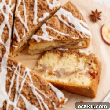 A delicious slice of homemade Apple Crumb Cake with a generous maple glaze.