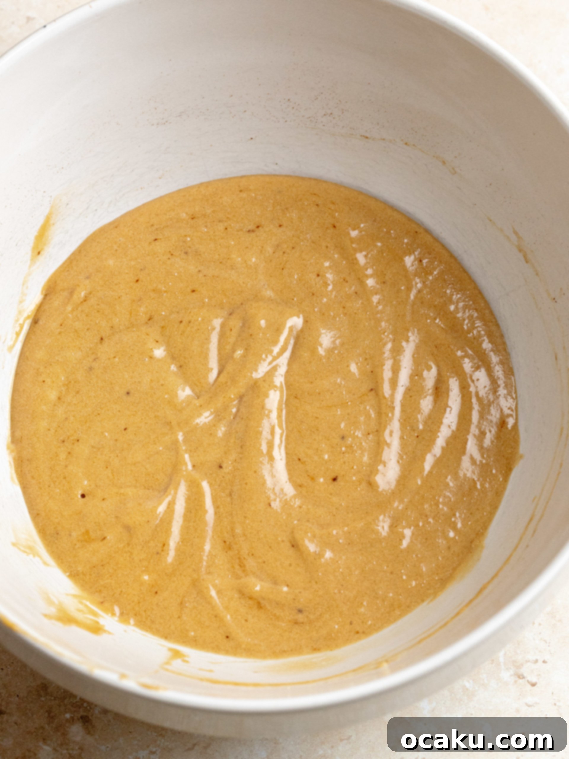 Baked Tiramisu cupcakes cooling on a wire rack.