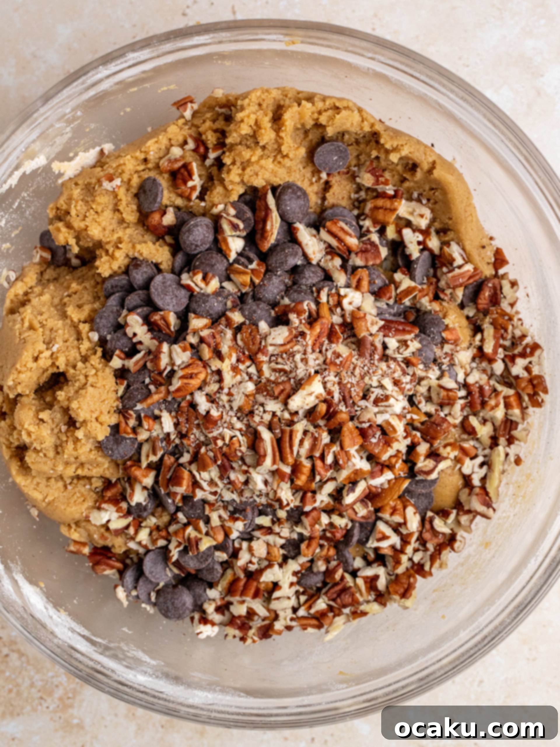 Decadent Chocolate Pecan Cookies 5 Adding dry ingredients (flour mixture) to the wet cookie dough.